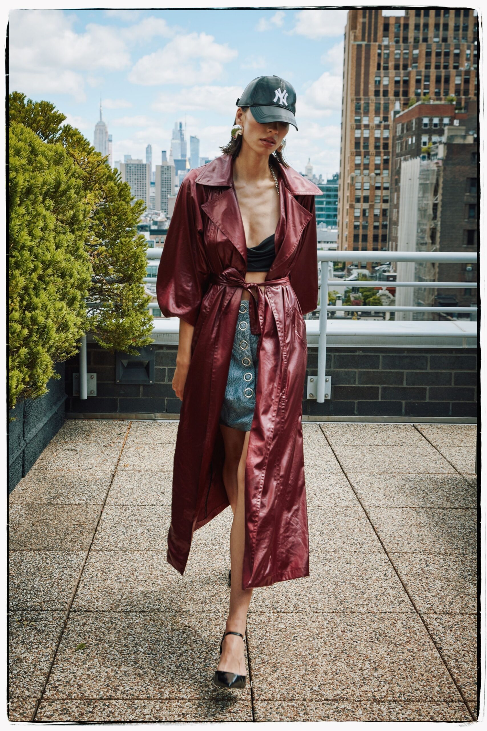 red vinyl long-sleeve collared relaxed belted zippered coat