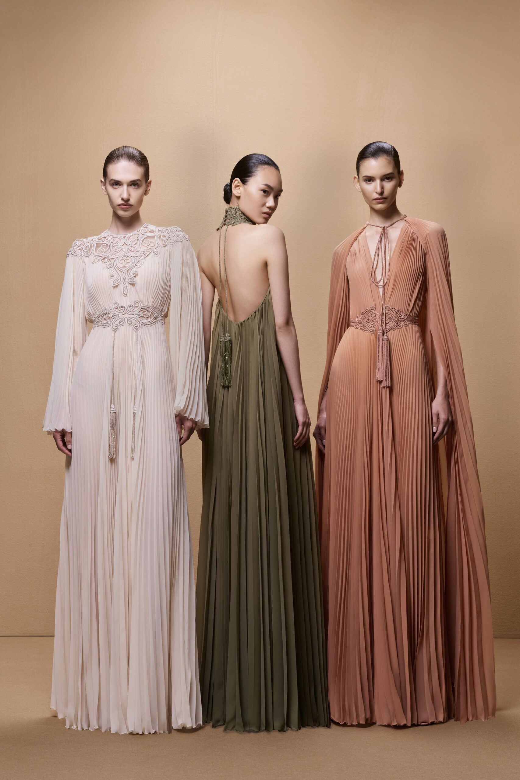 green silk sleeveless v-neck fitted pleated maxi gown