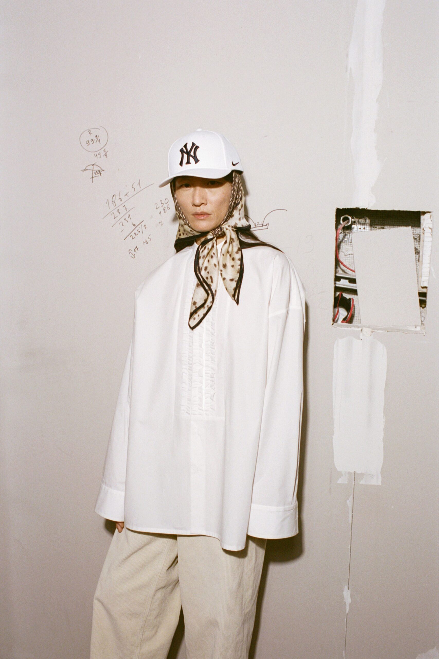 white cotton long-sleeve collared oversized pleated shirt