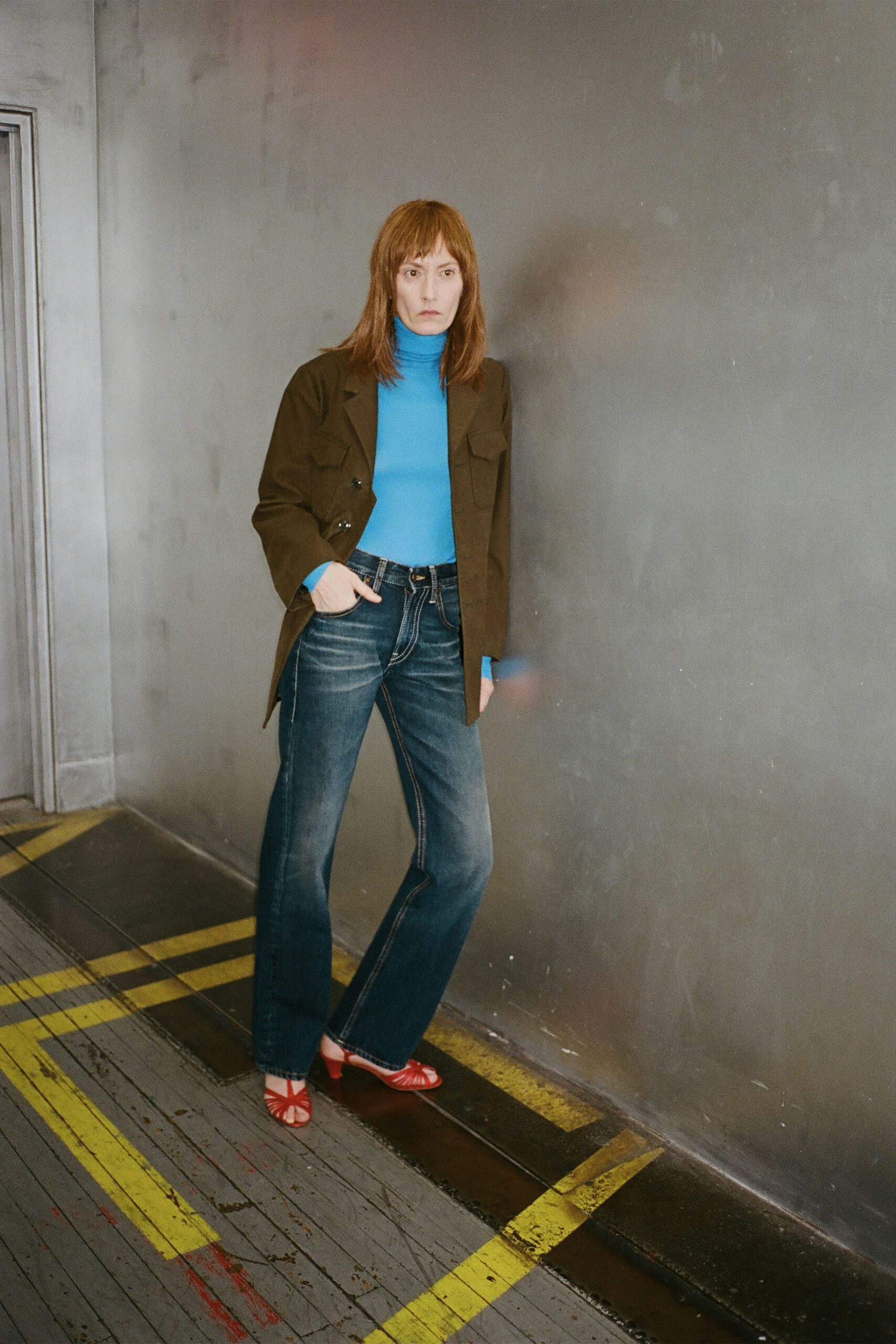 blue fitted top with brown jacket