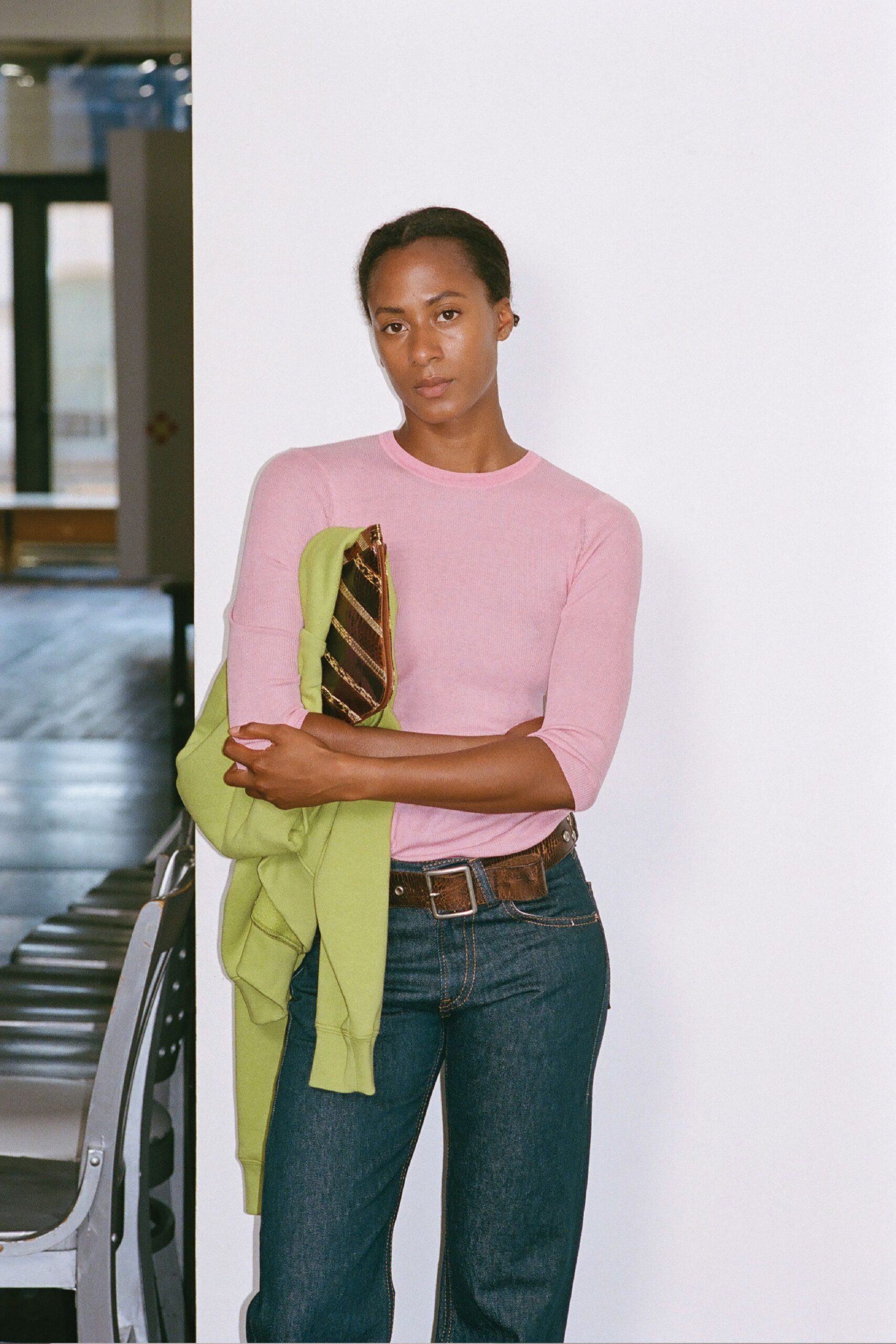 pink fitted top with green jacket