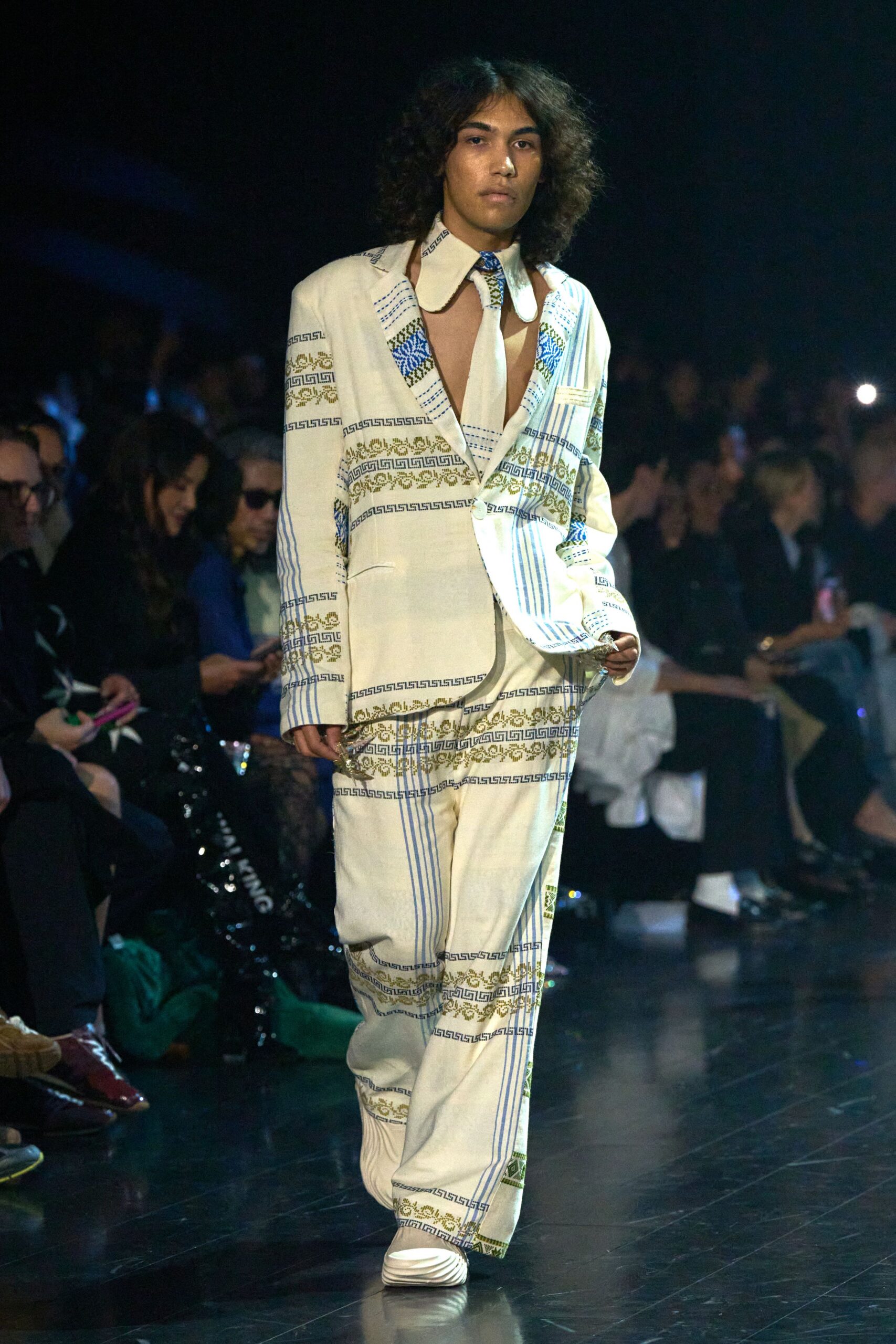 white tailored suit with blue embroidery