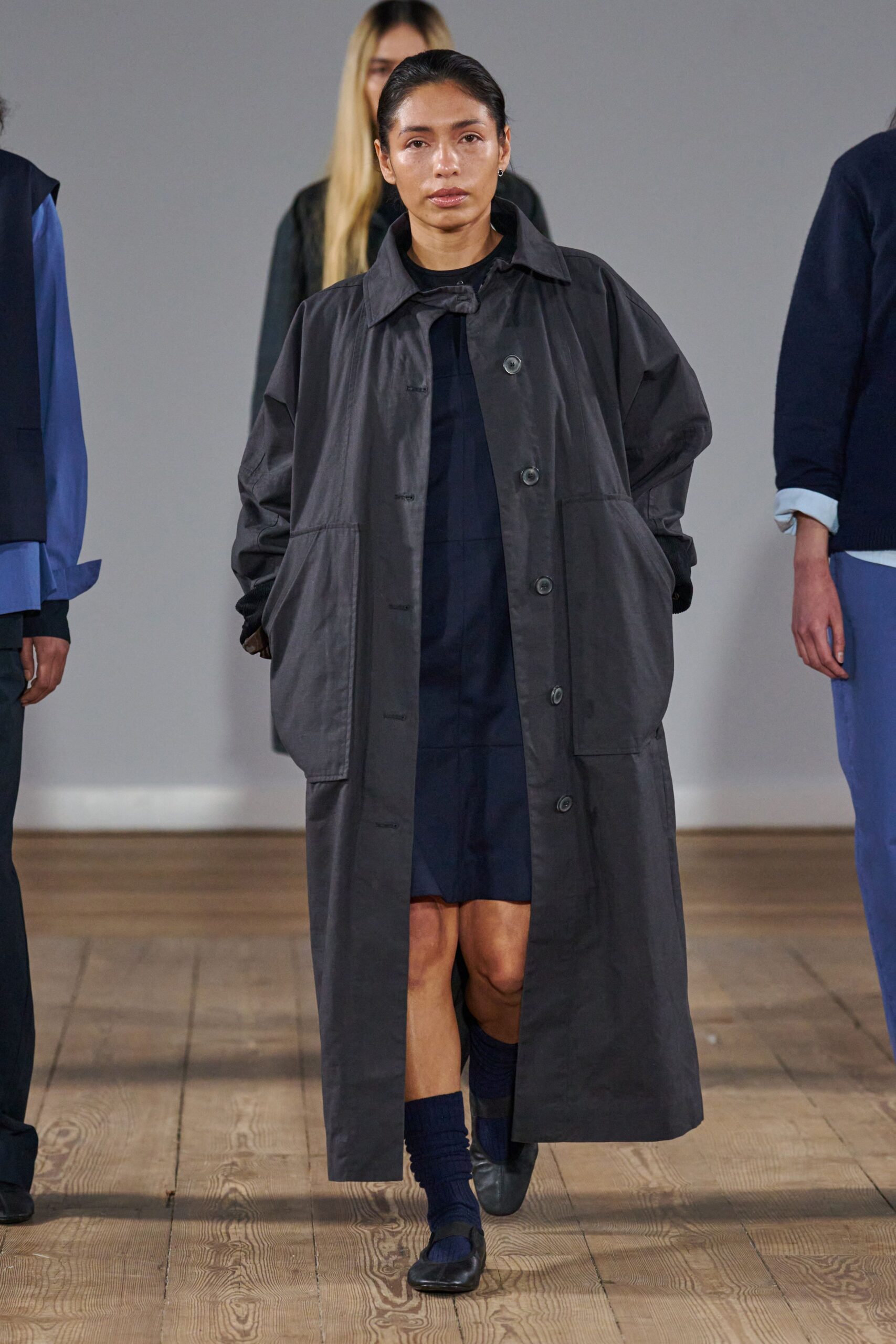 black coat over navy dress