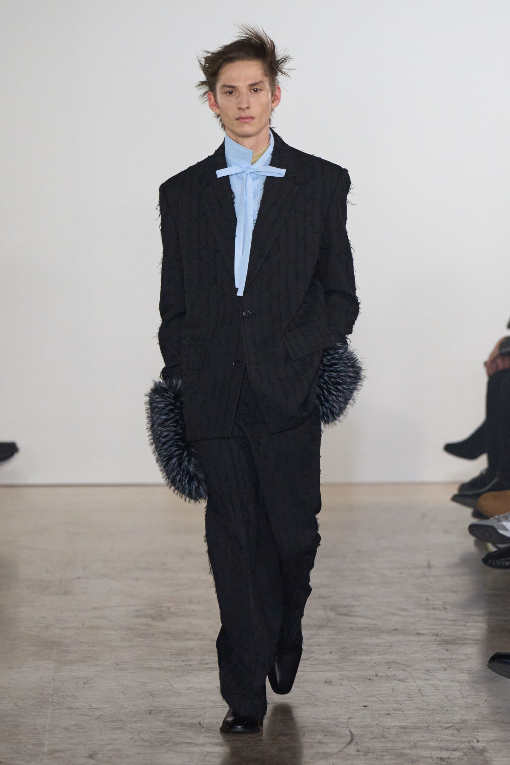 black cotton long-sleeve collared structured buttoned pleated suit