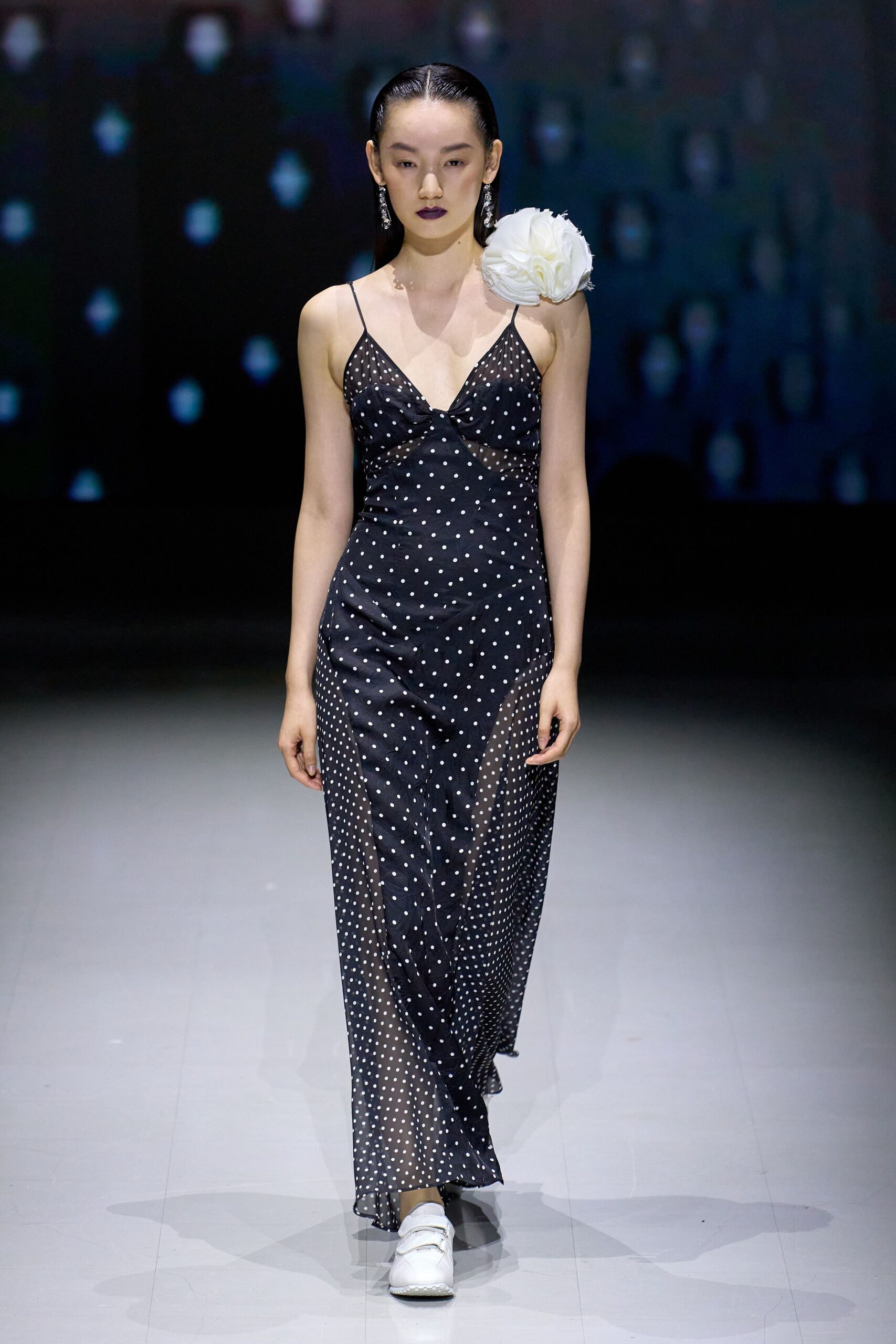 black polka-dot maxi dress with white shoes