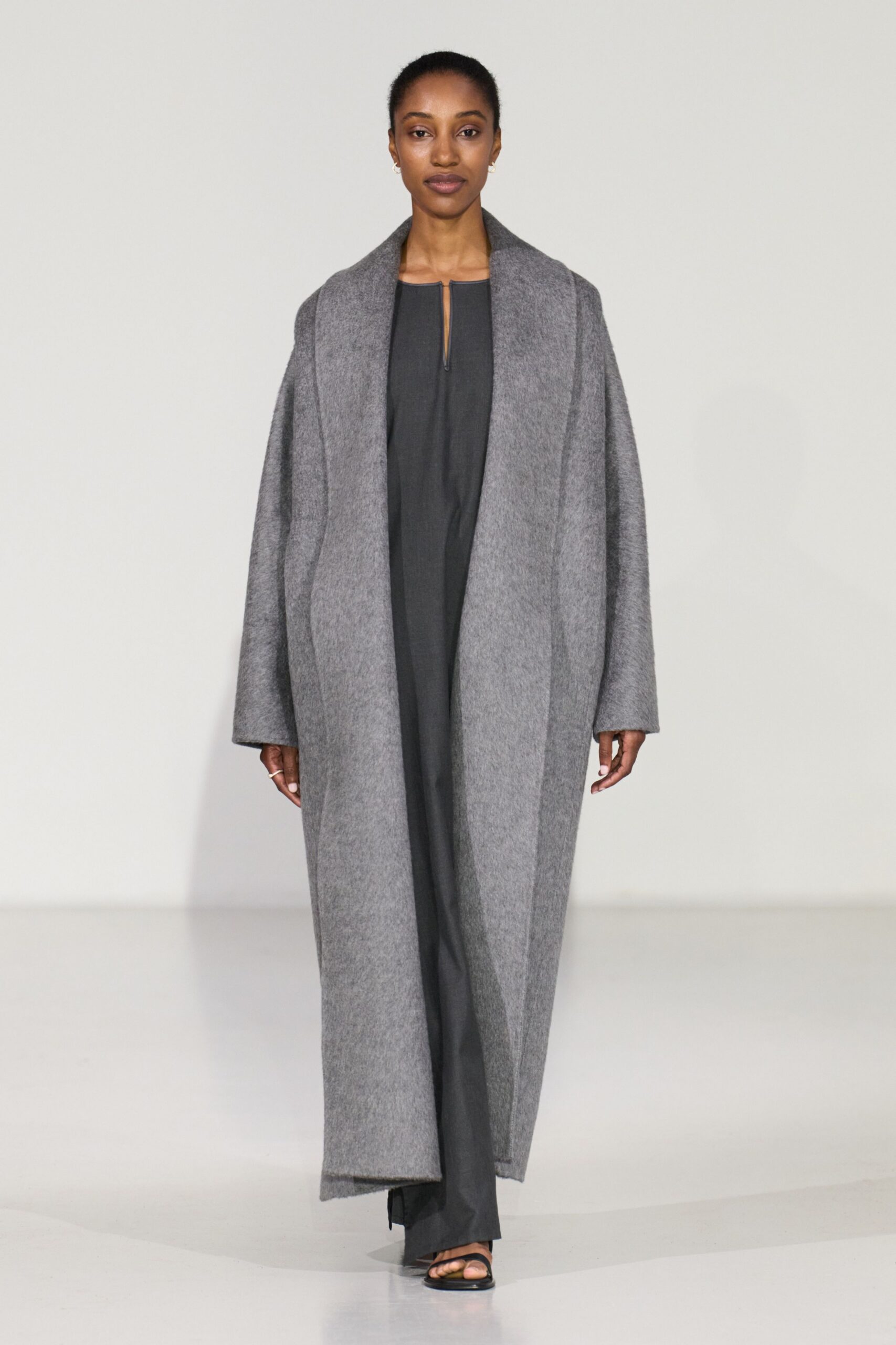 gray wool coat with black jumpsuit