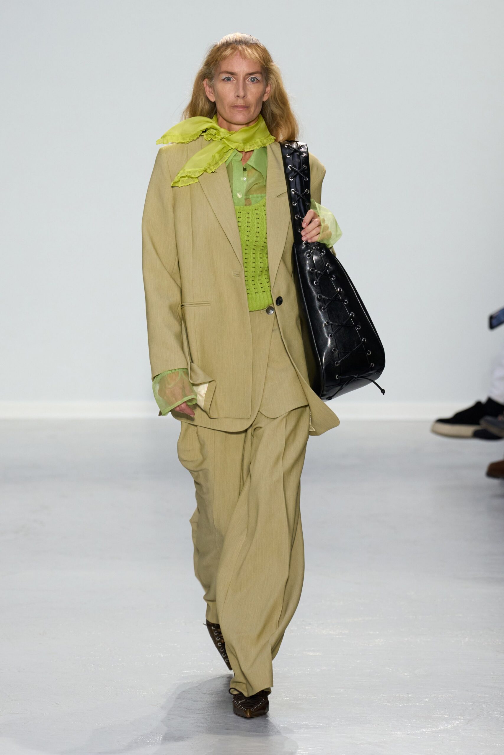 beige suit with green shirt