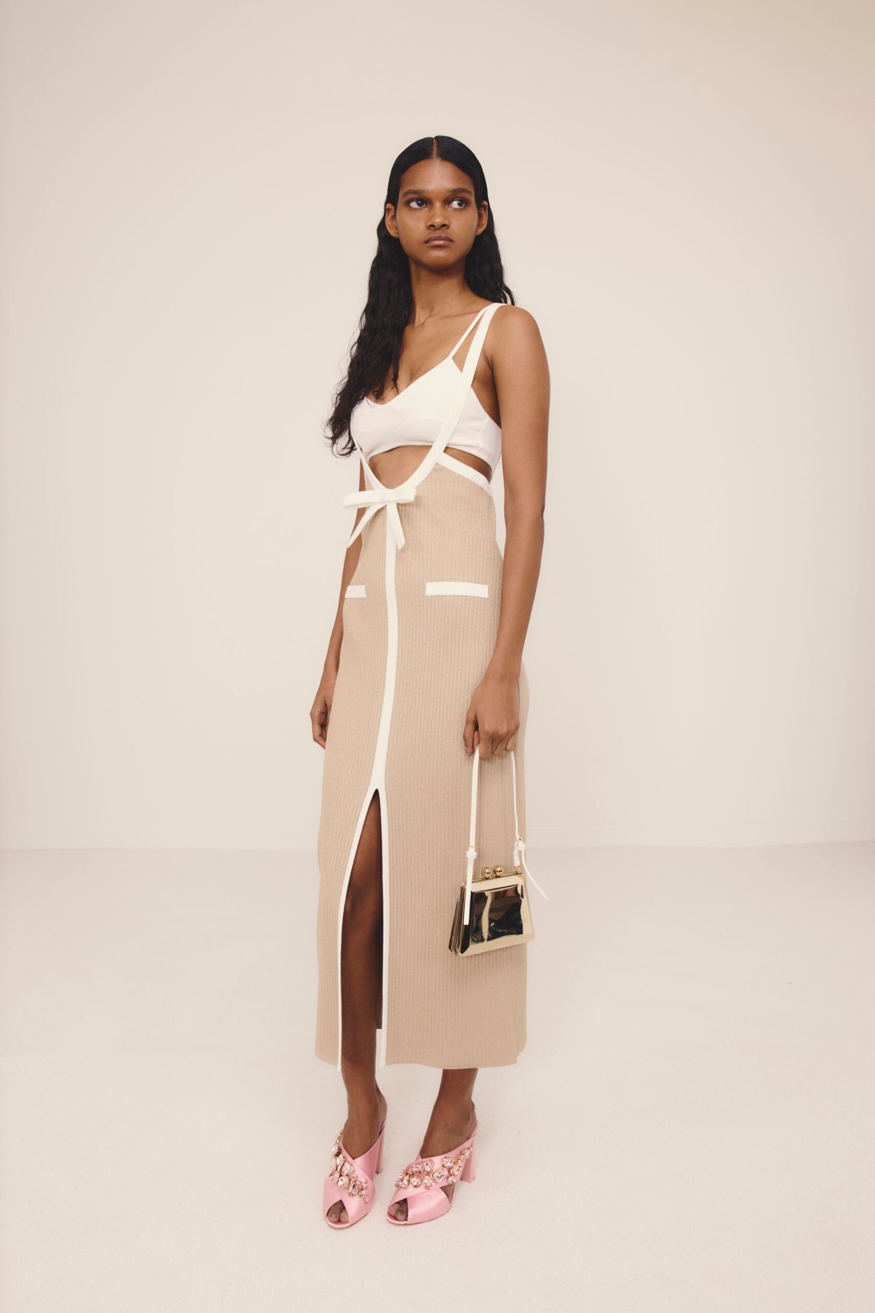 beige cotton sleeveless v-neck fitted tiered belted dress