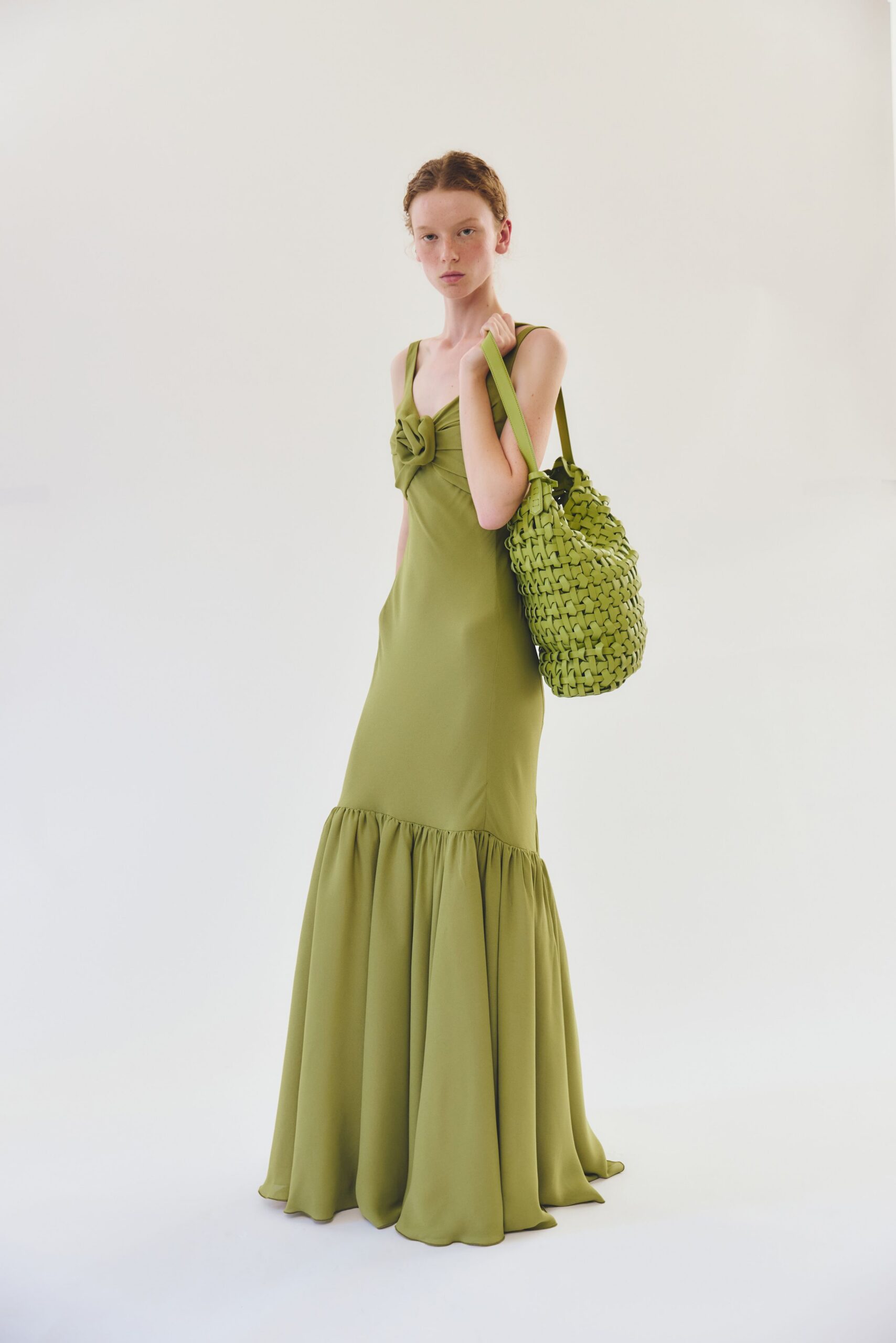 green silk sleeveless v-neck fitted ruffled tiered gown