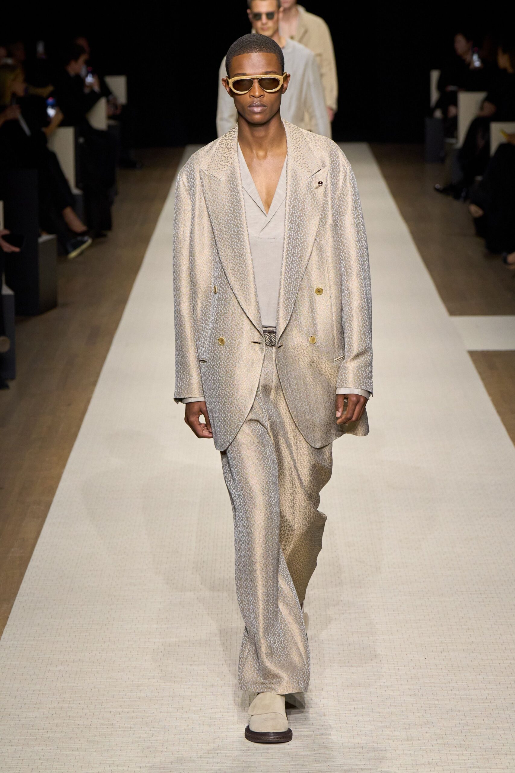 beige tailored suit with sunglasses
