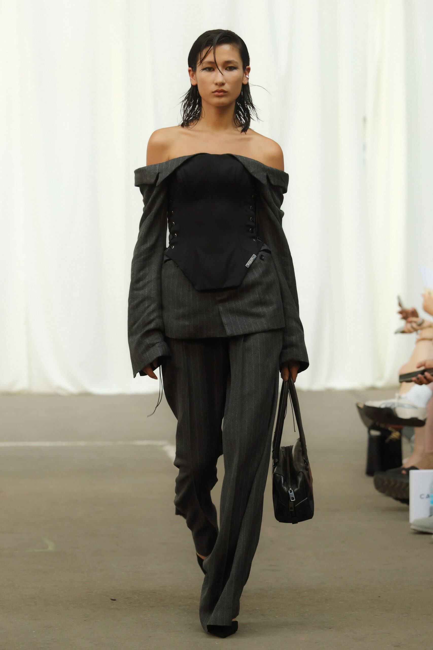 gray tailored pants and black top