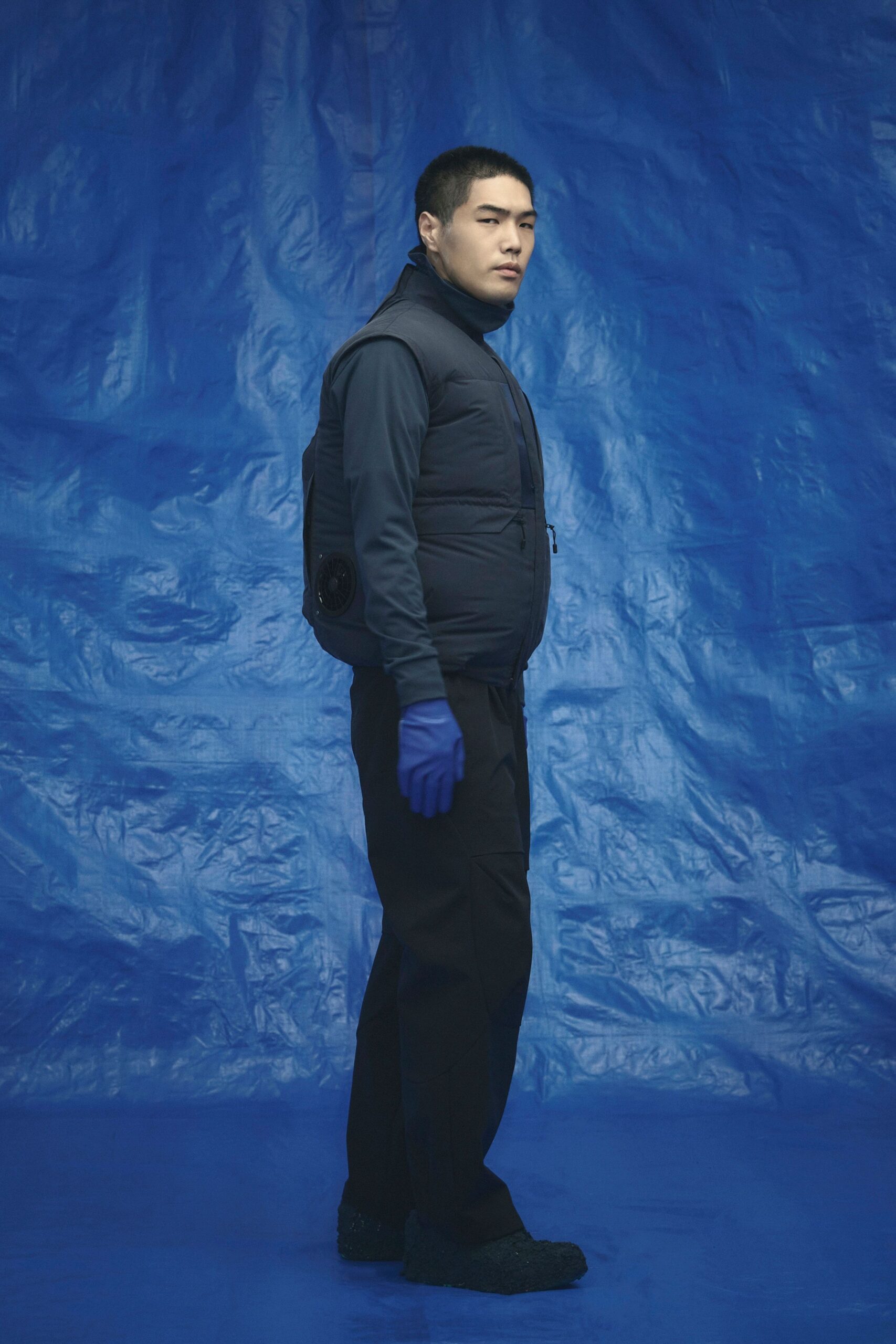 black nylon vest with blue shirt