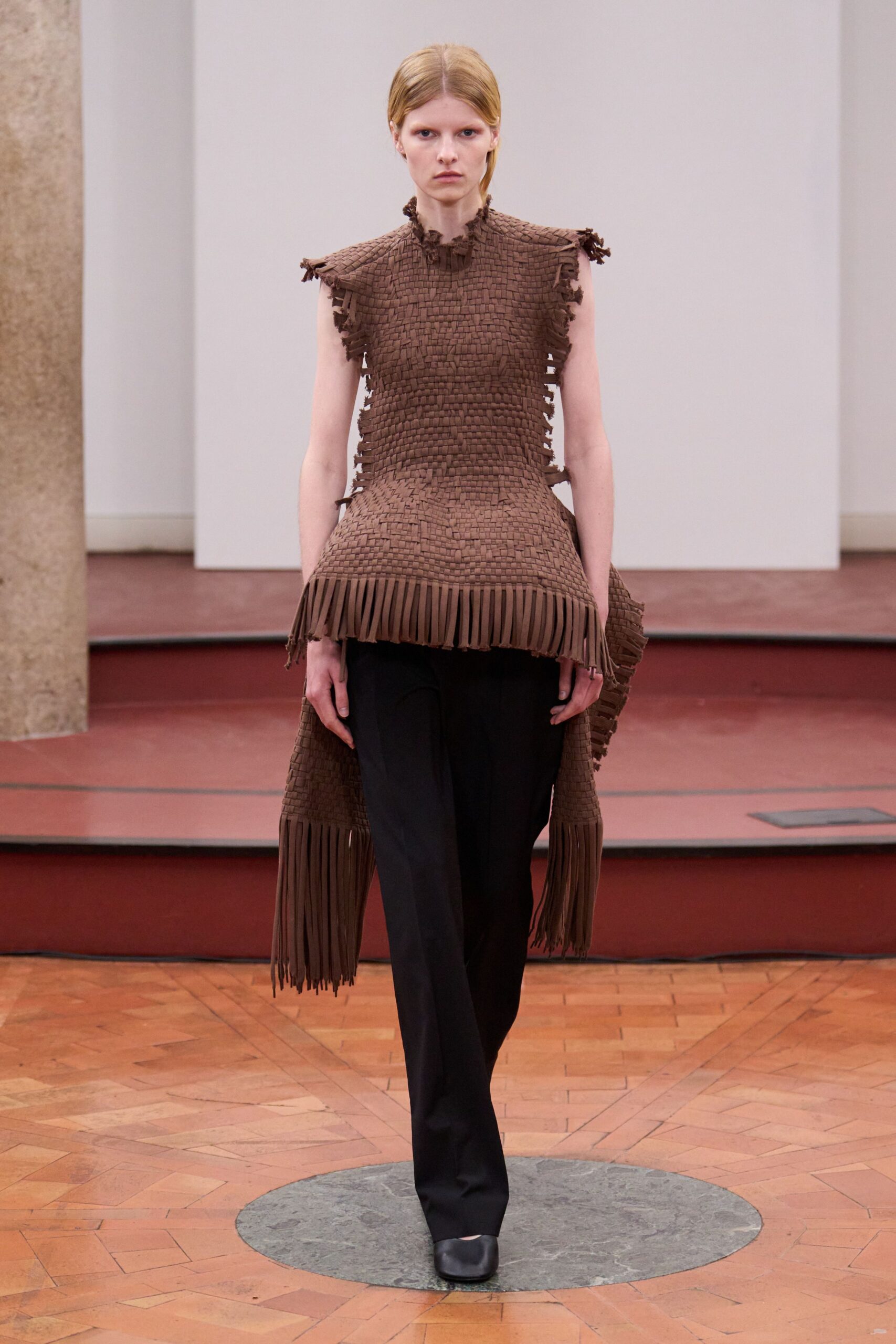 brown fringed top with black pants