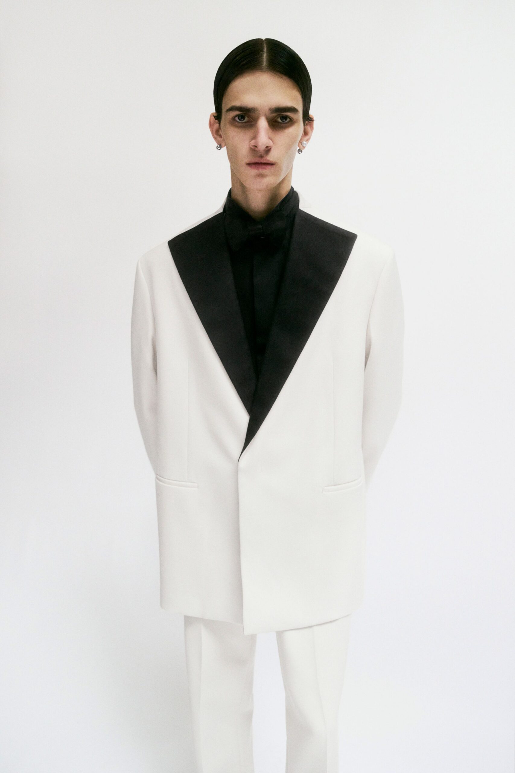 white tailored suit with black lapel