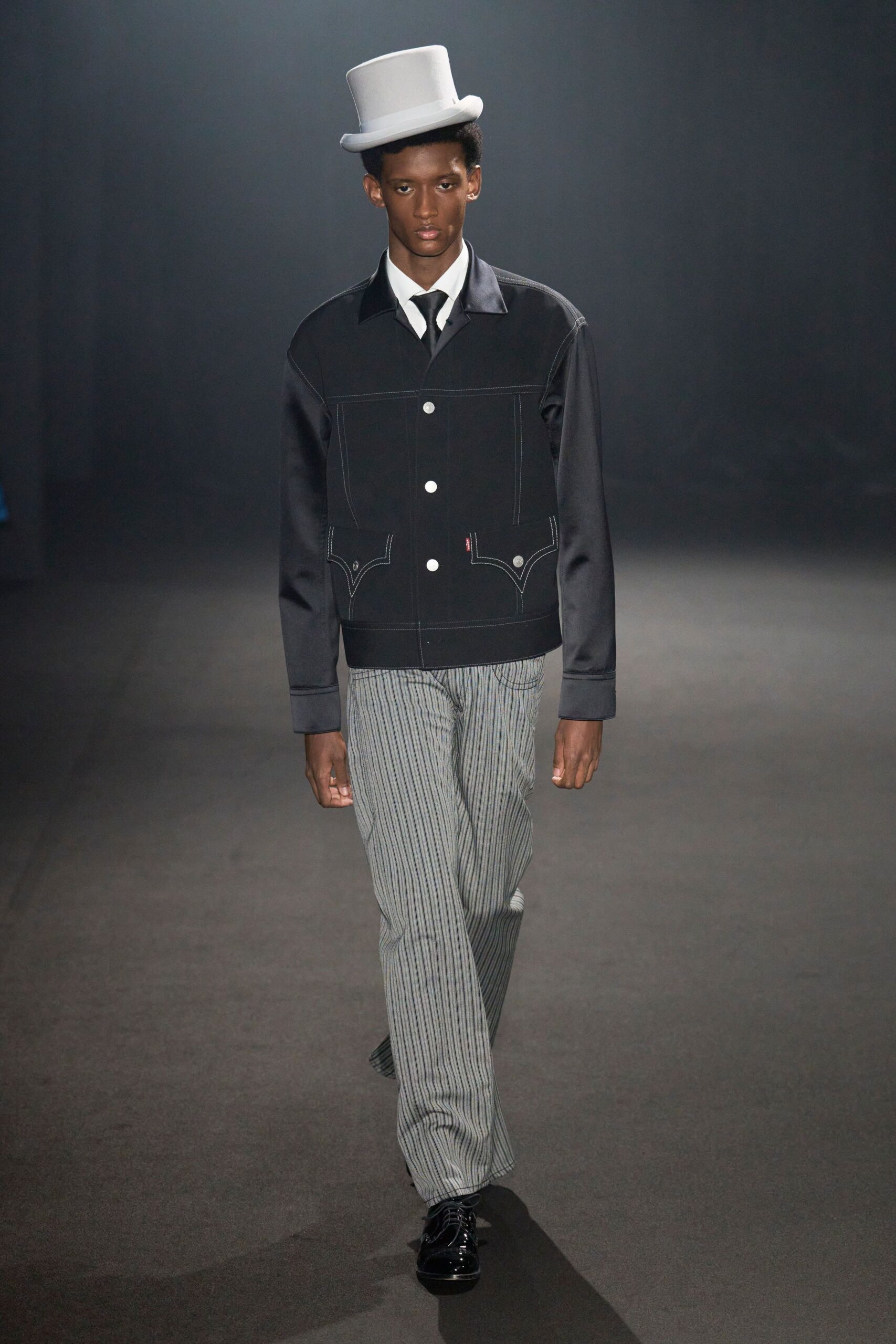 black jacket gray striped pants