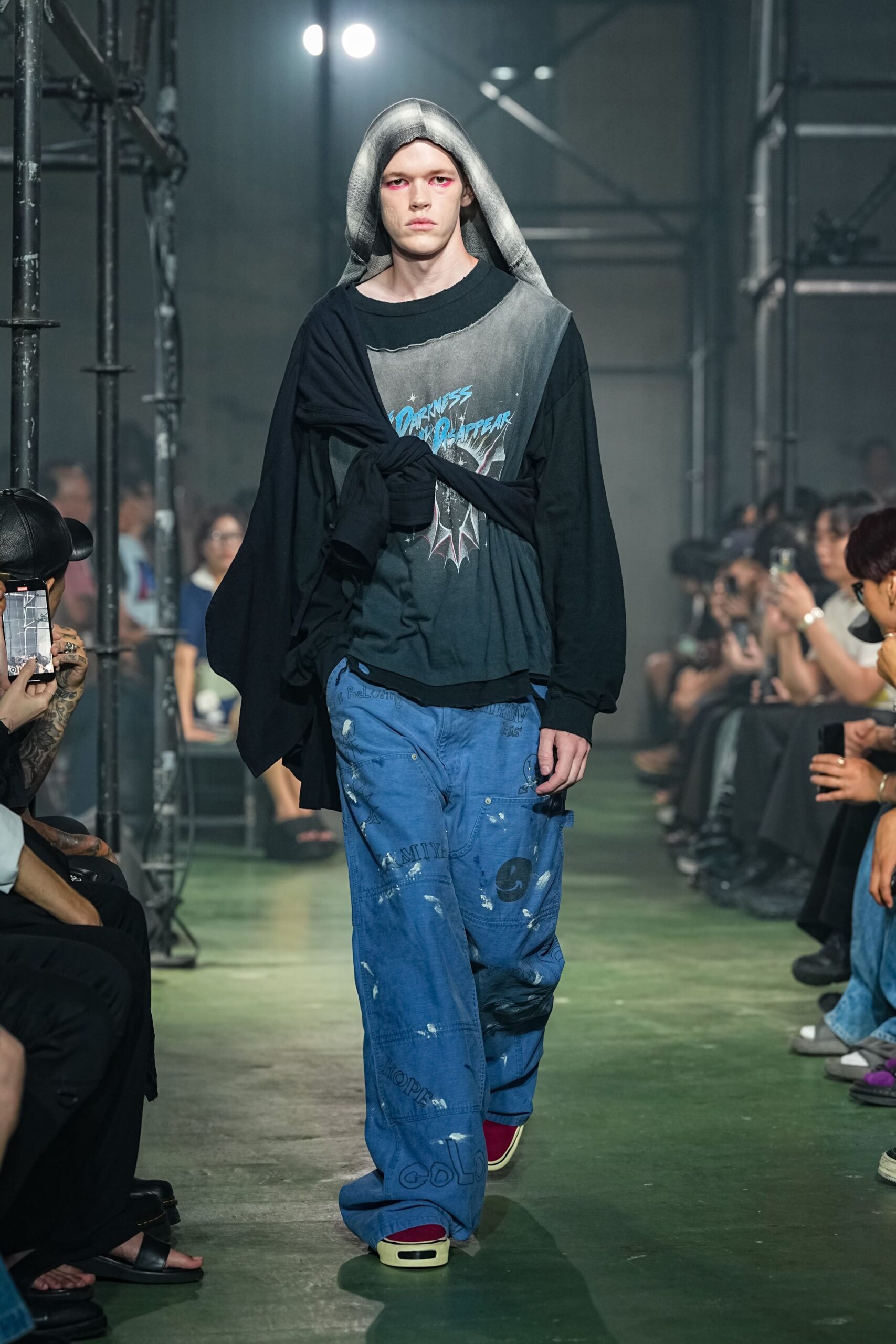 black hoodie with t-shirt and blue pants