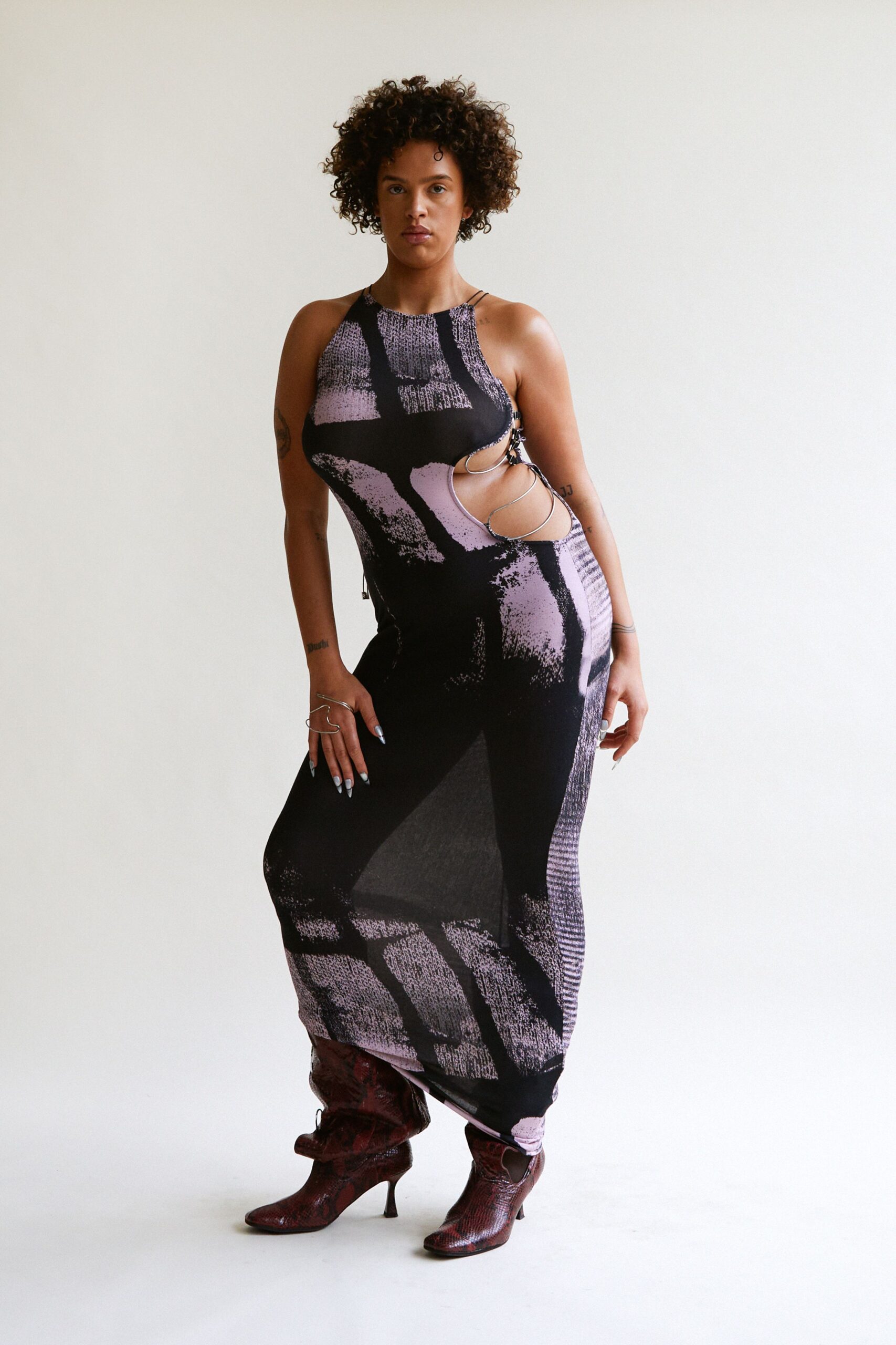 fitted black and purple maxi dress with cutouts