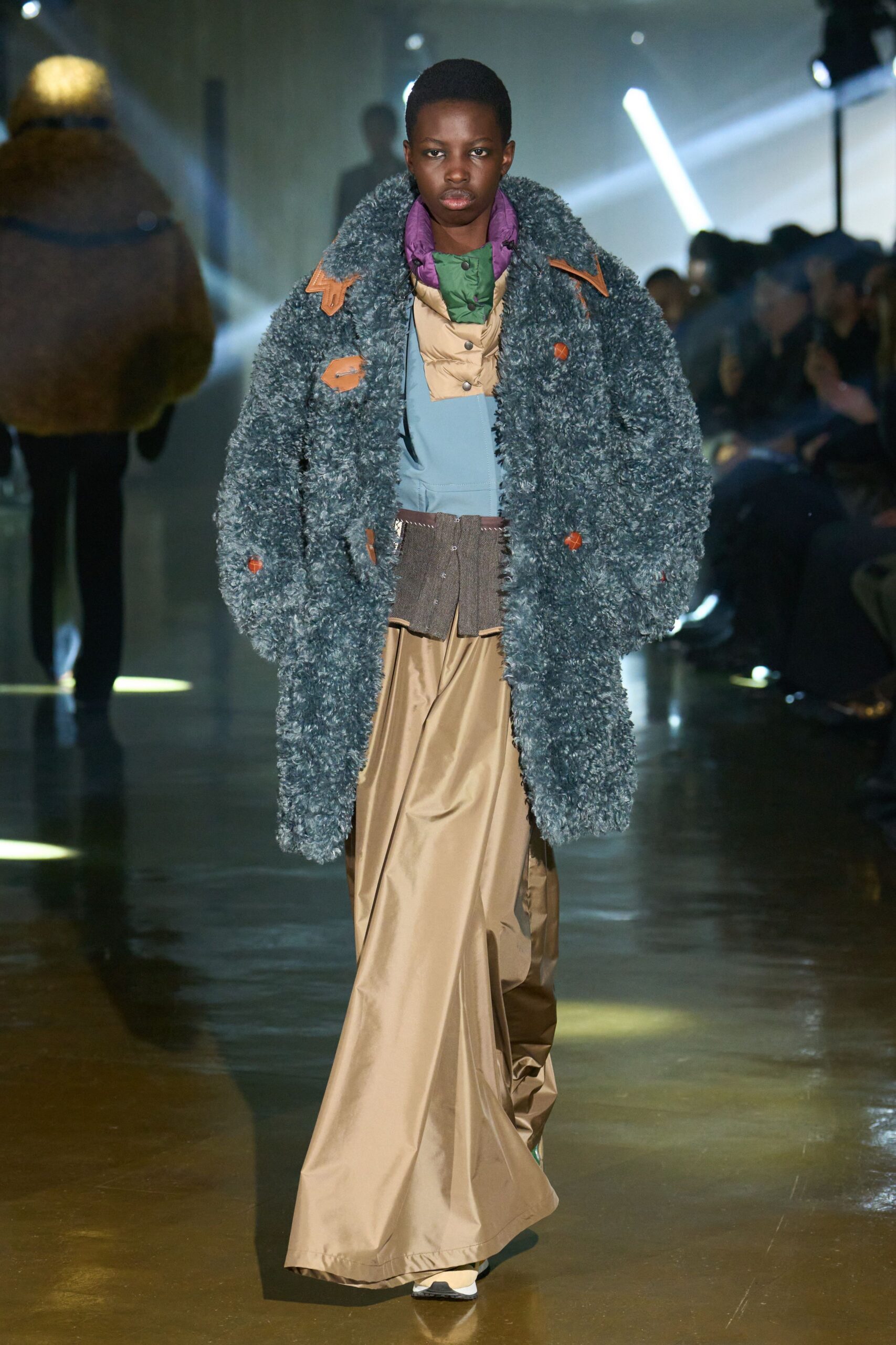 gray faux-fur coat with beige pants