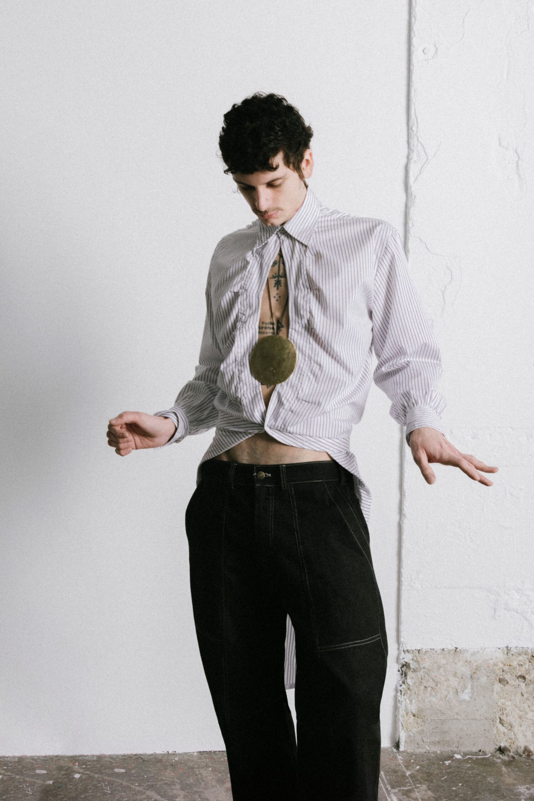 striped shirt and black pants