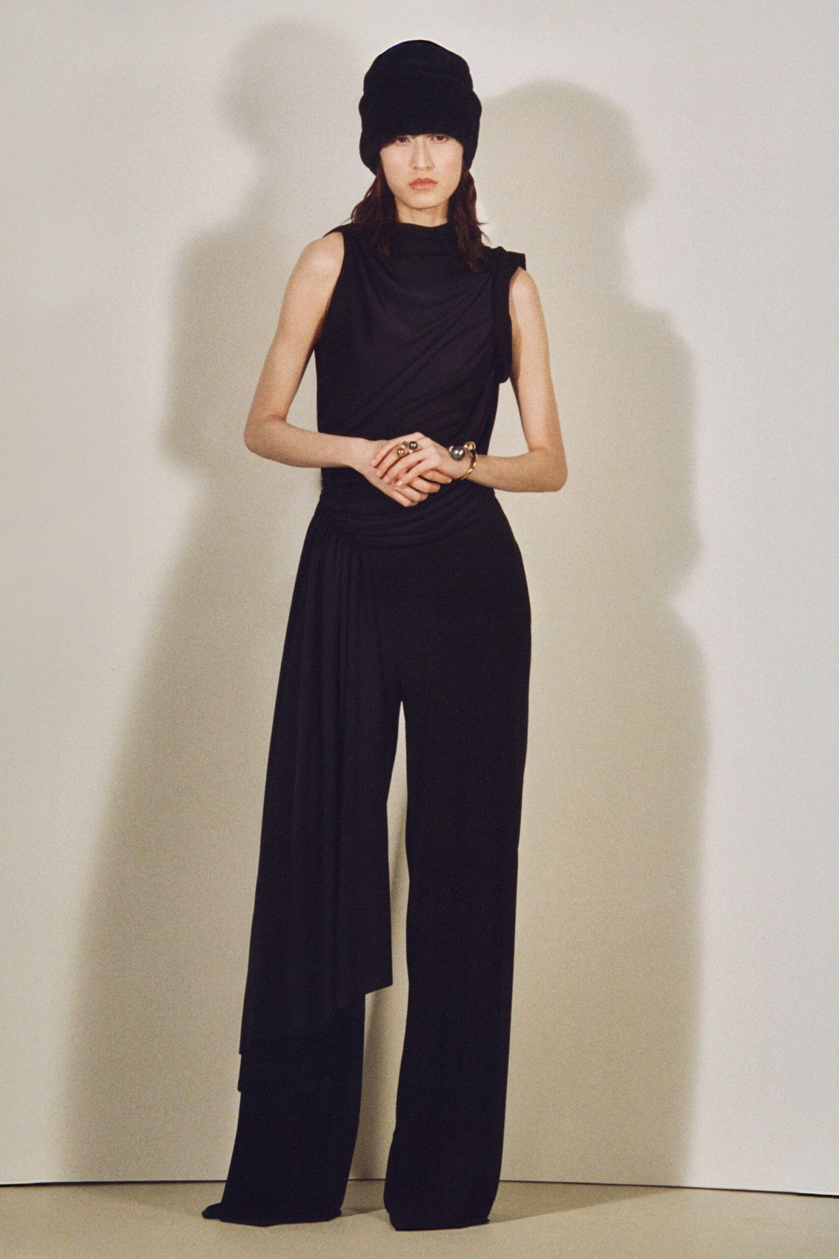 black silk sleeveless high-neck fitted draped jumpsuit