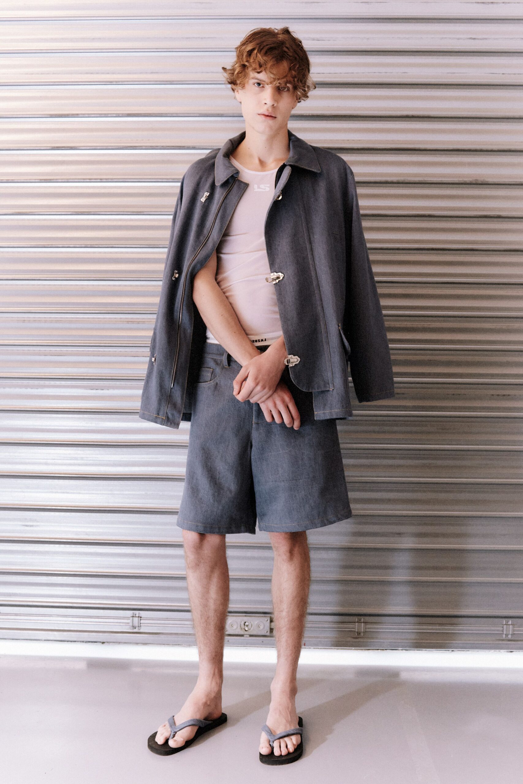 gray jacket with white top and shorts