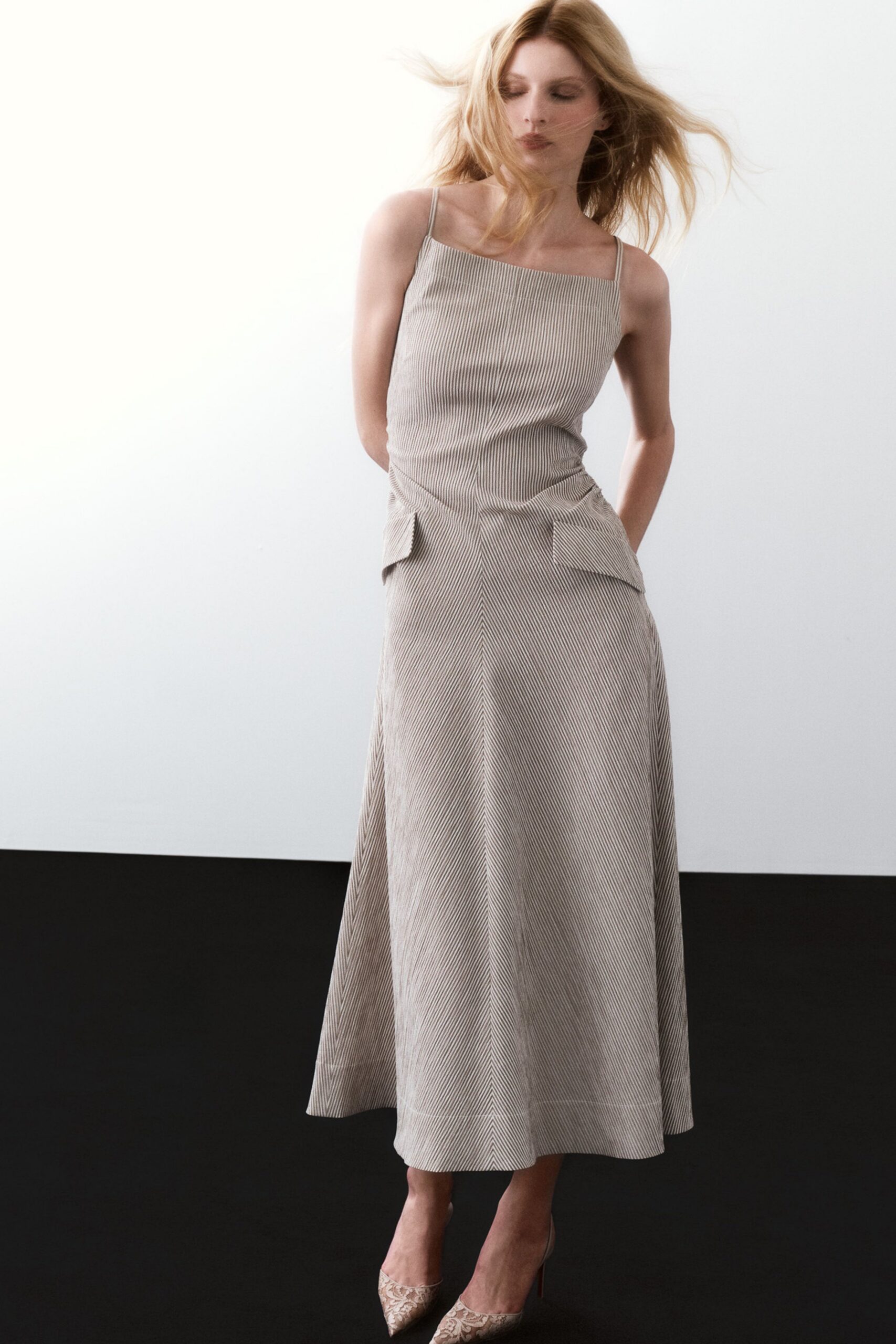 beige fitted midi dress with pockets