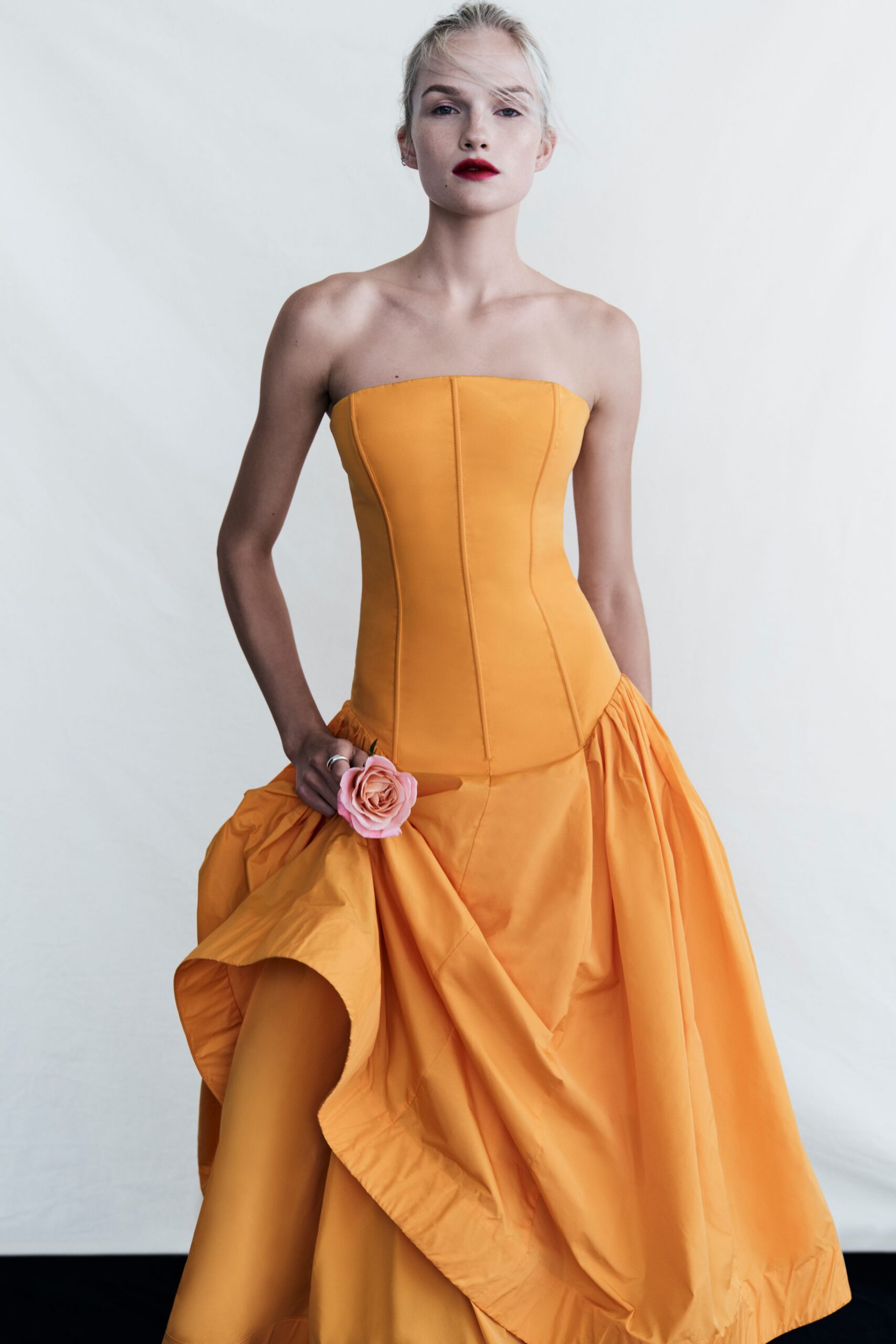yellow strapless pleated gown