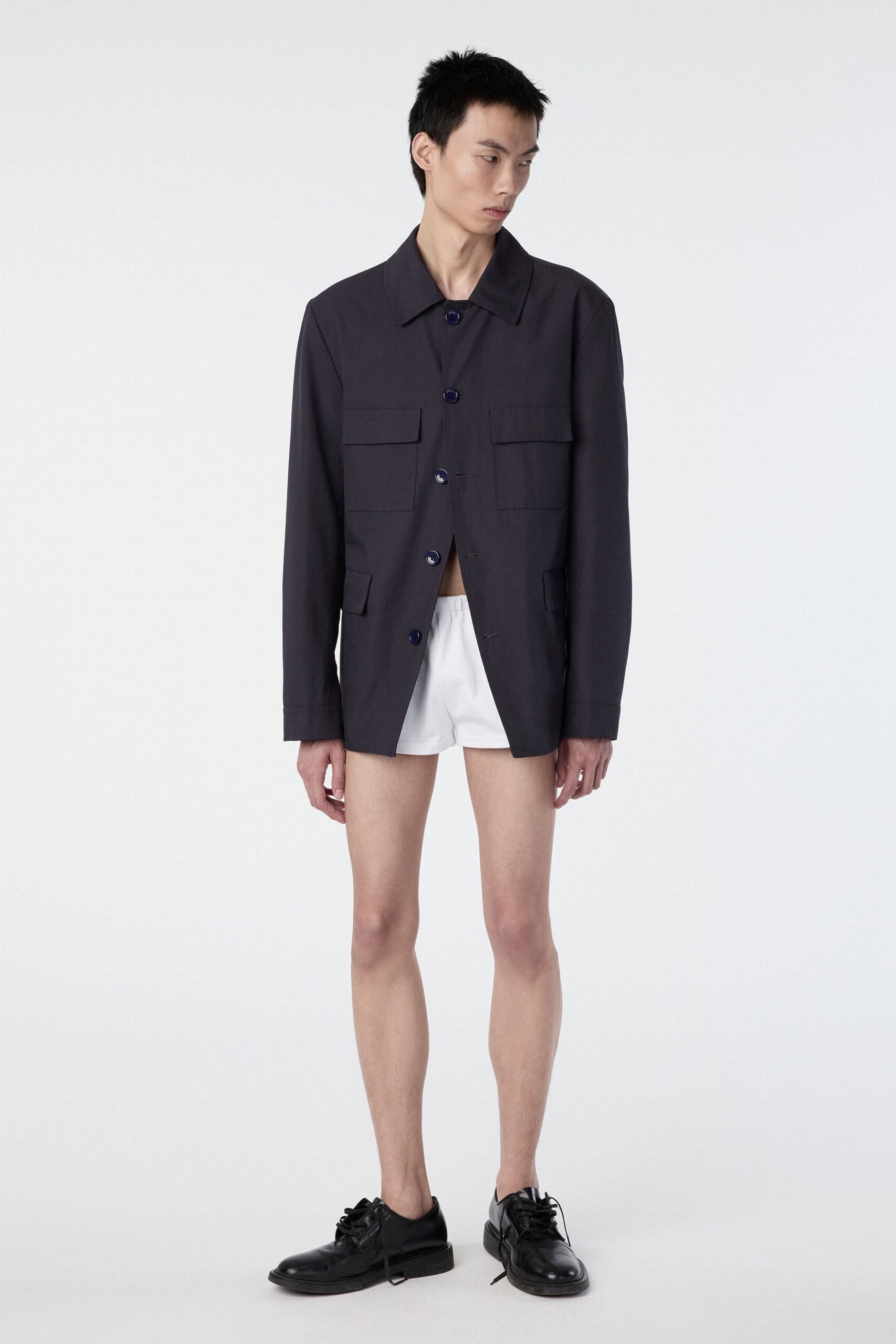 black relaxed jacket with white shorts