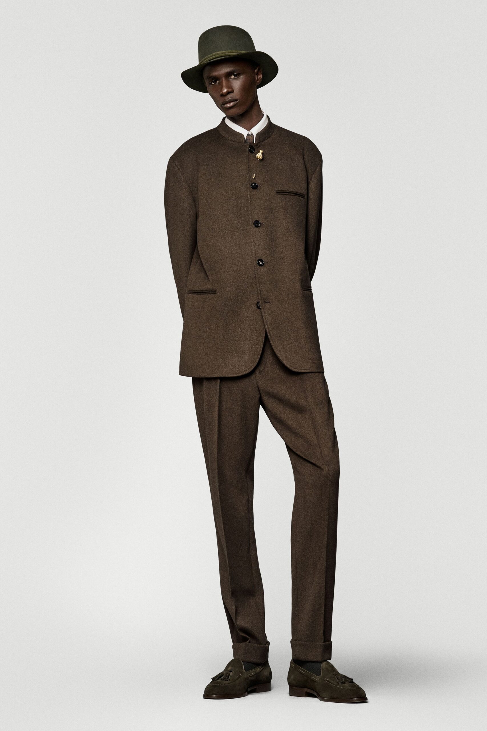brown tailored suit with hat