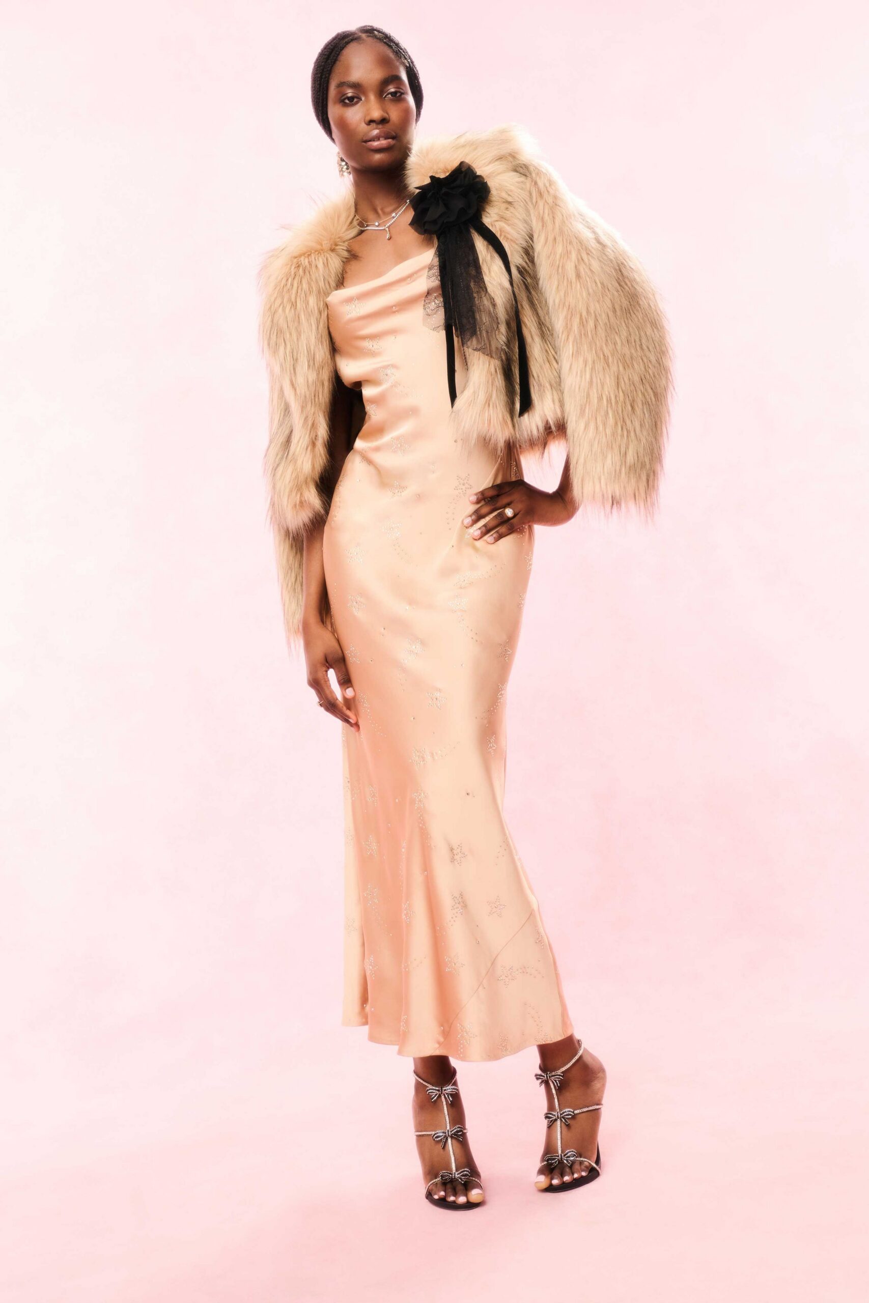 peach silk fitted gown with fur coat