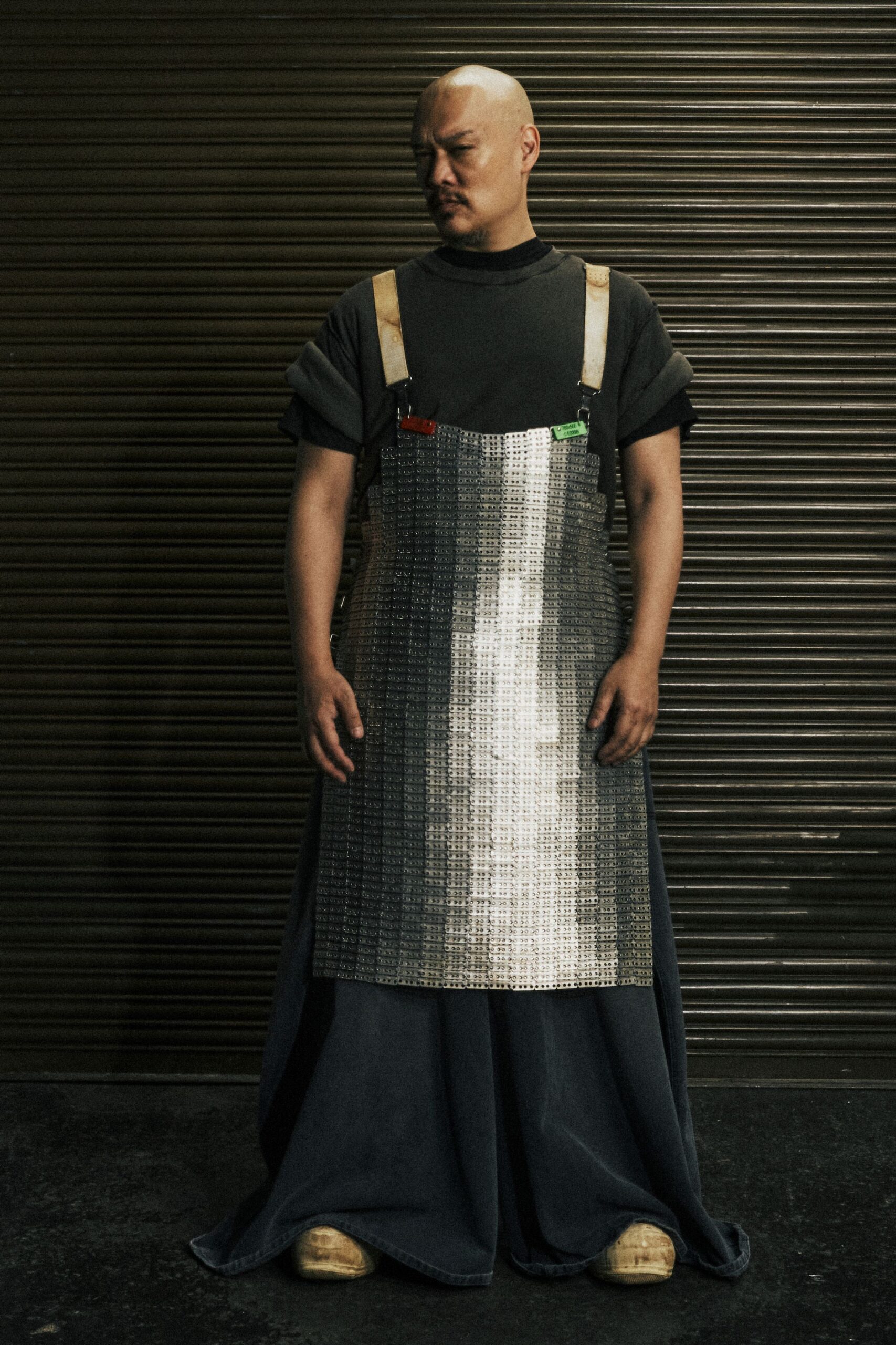 black relaxed jumpsuit with metallic apron