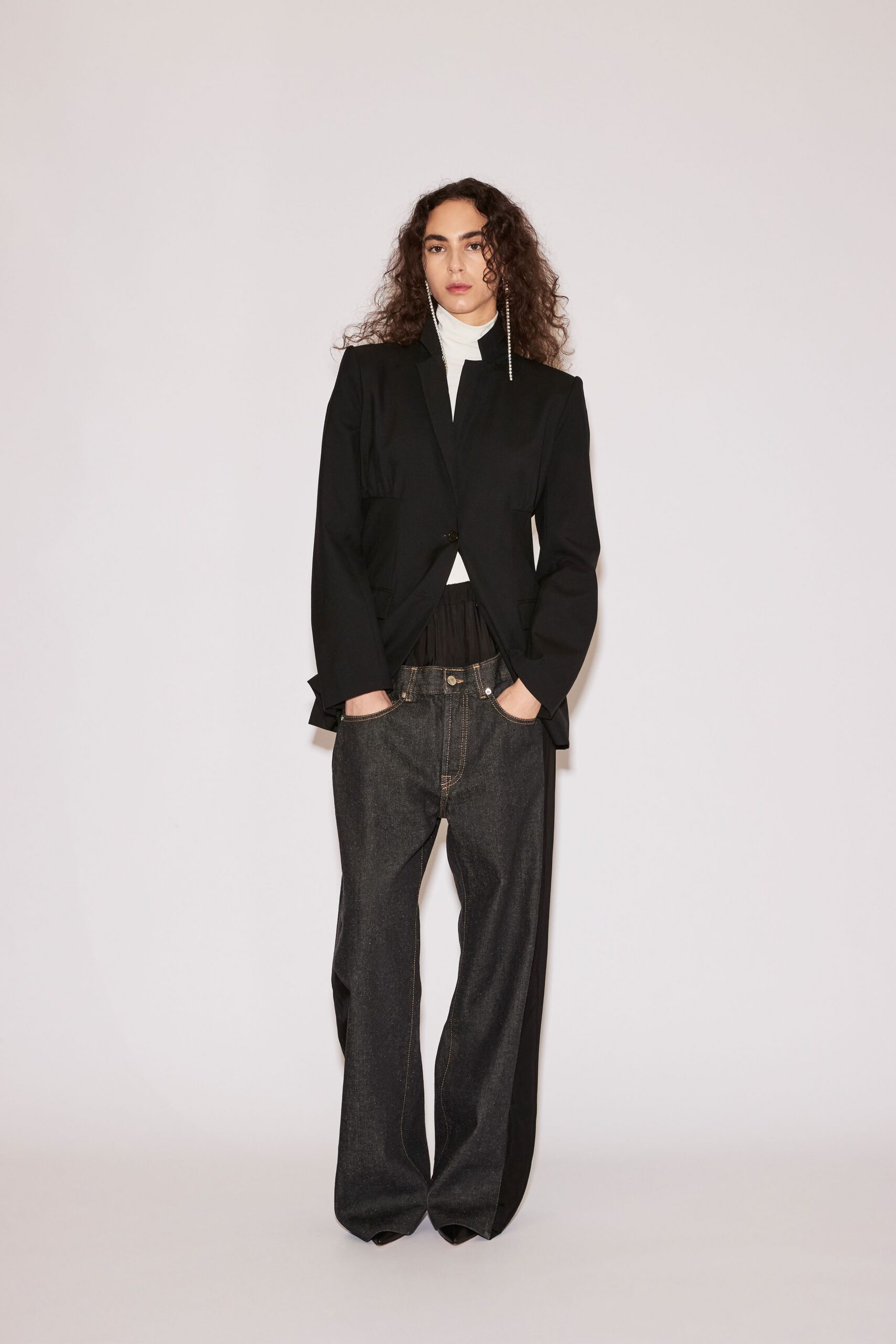 black blazer white turtleneck blue jeans
