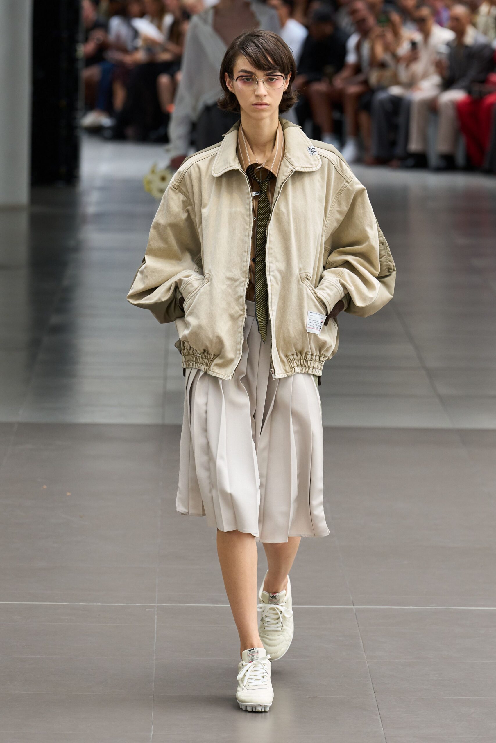 beige oversized jacket white pleated skirt