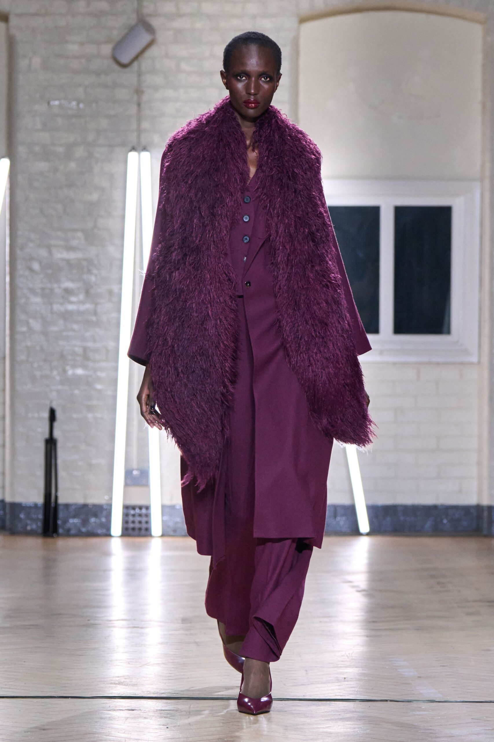 purple faux-fur coat with suit