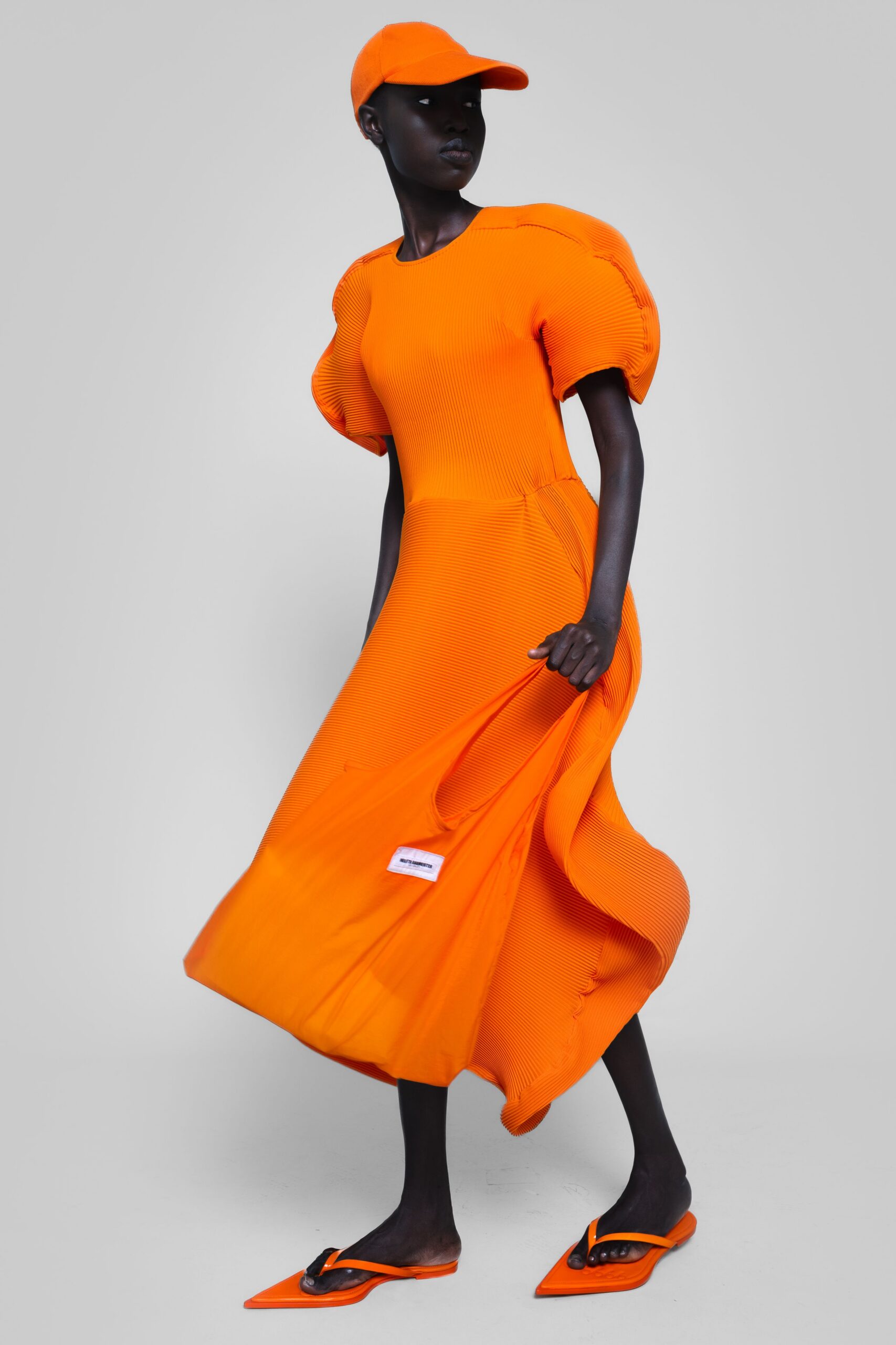 orange cotton short-sleeve high-neck fitted pleated flowing dress