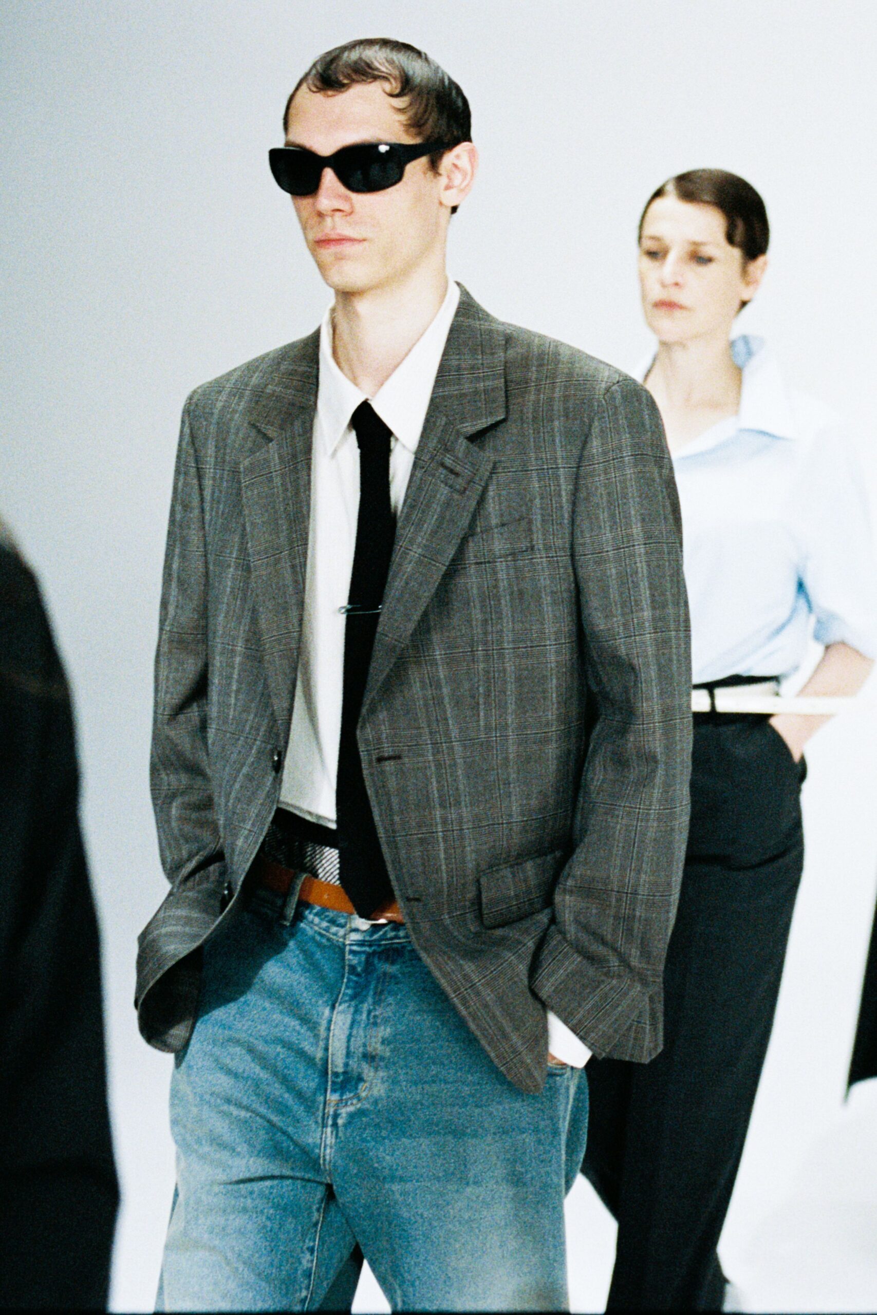 gray checked blazer with denim pants