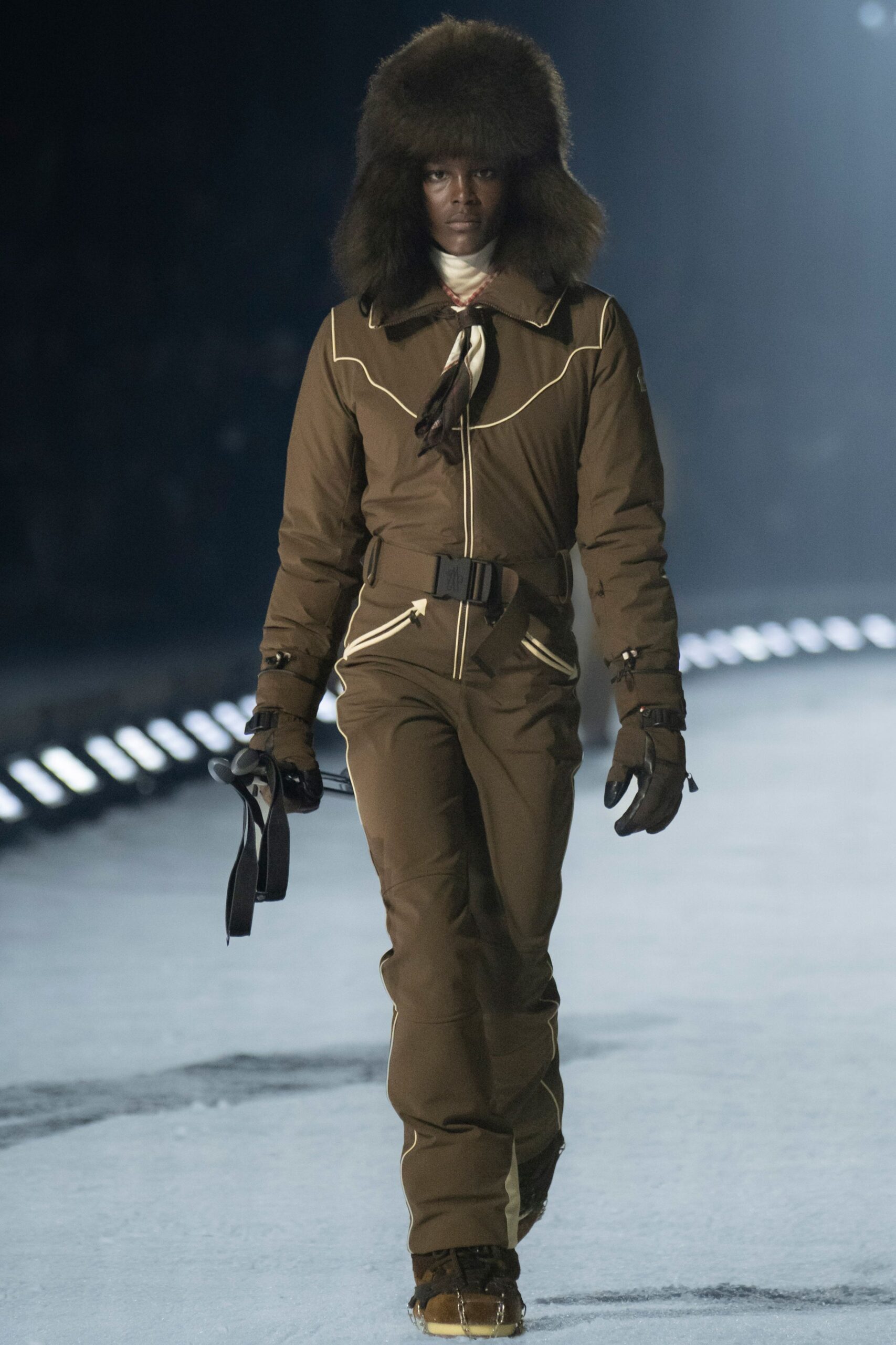brown fitted jumpsuit with fur hat