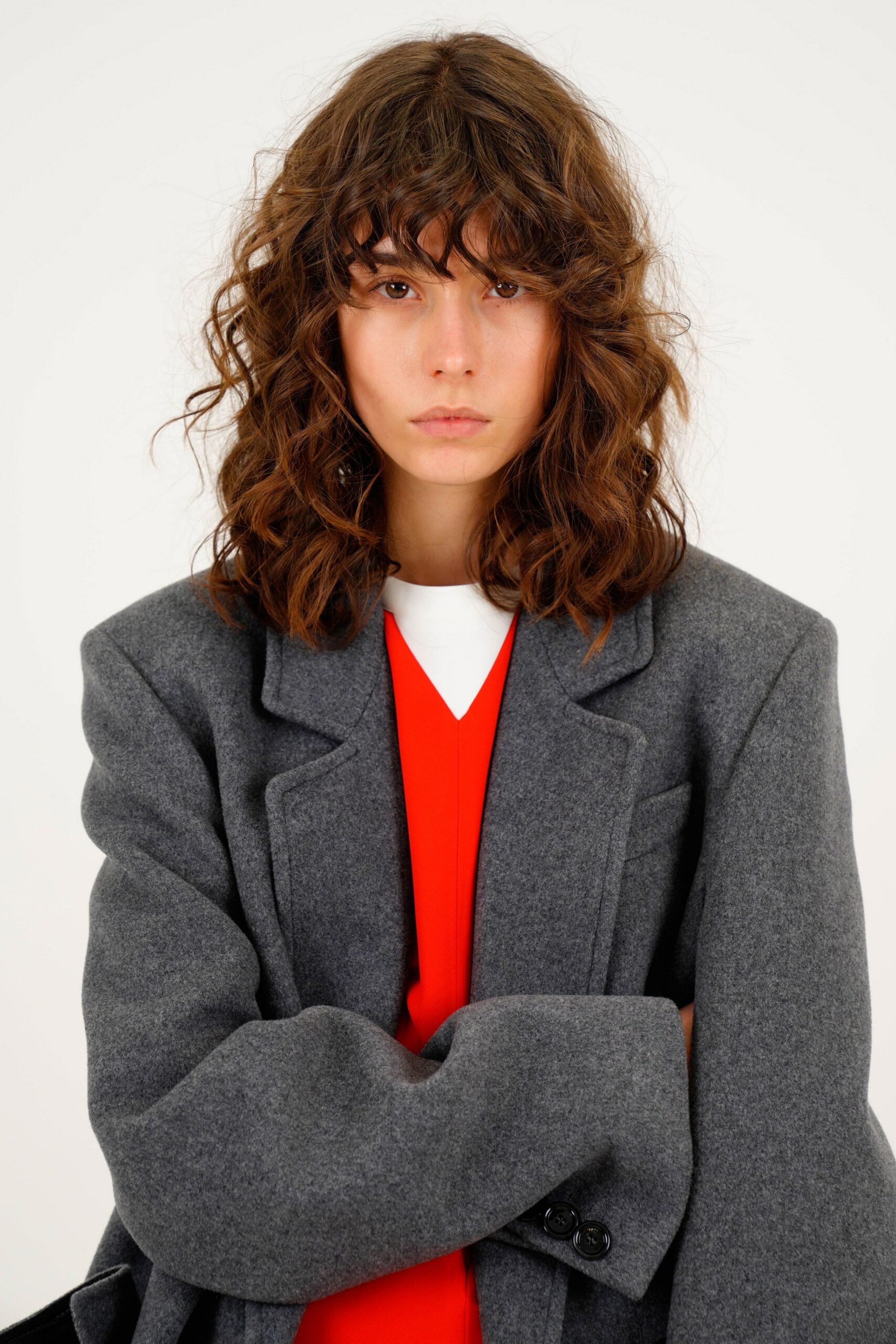 gray oversized blazer and red top
