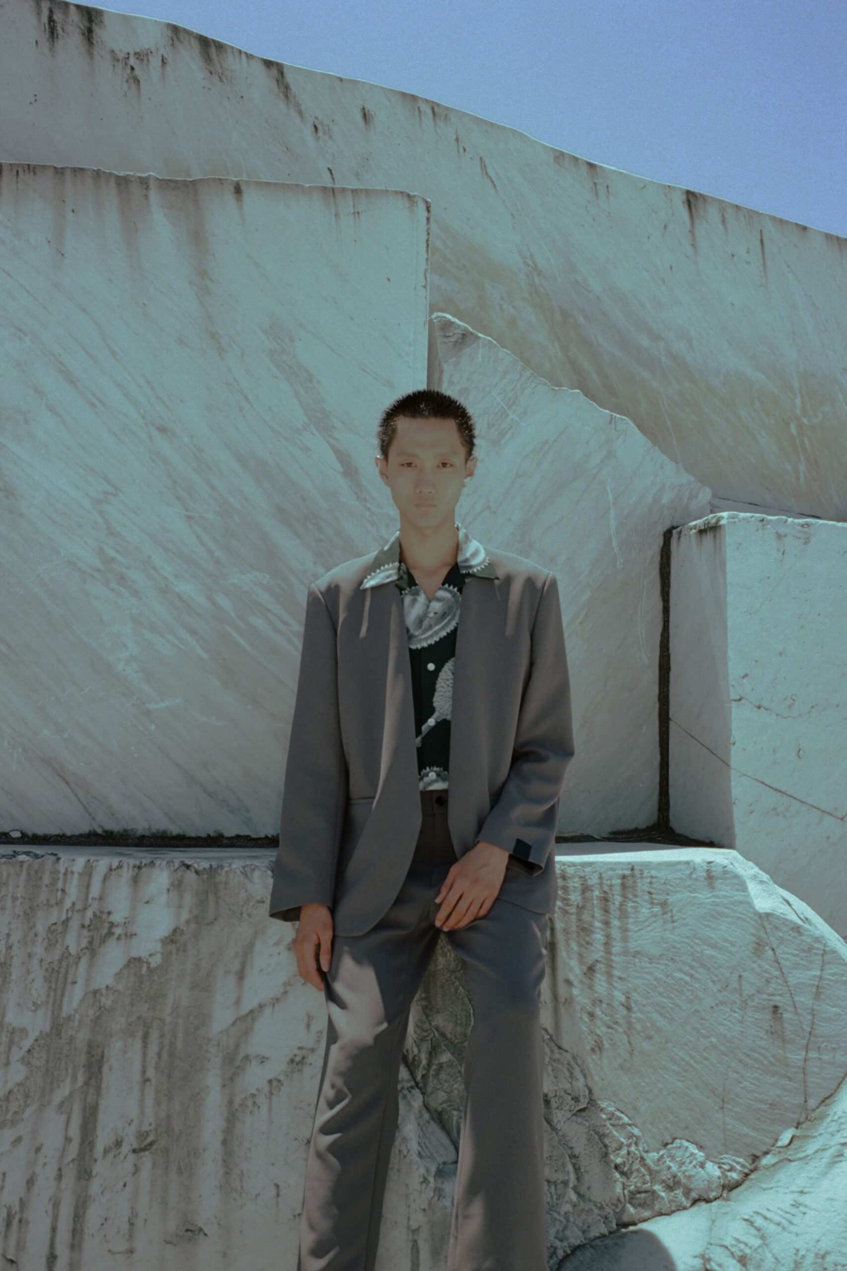gray tailored suit with polka-dot shirt
