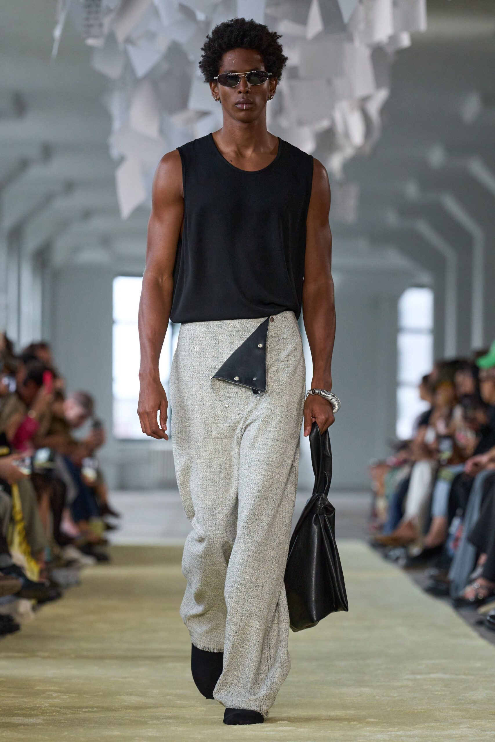 black sleeveless top beige relaxed pants