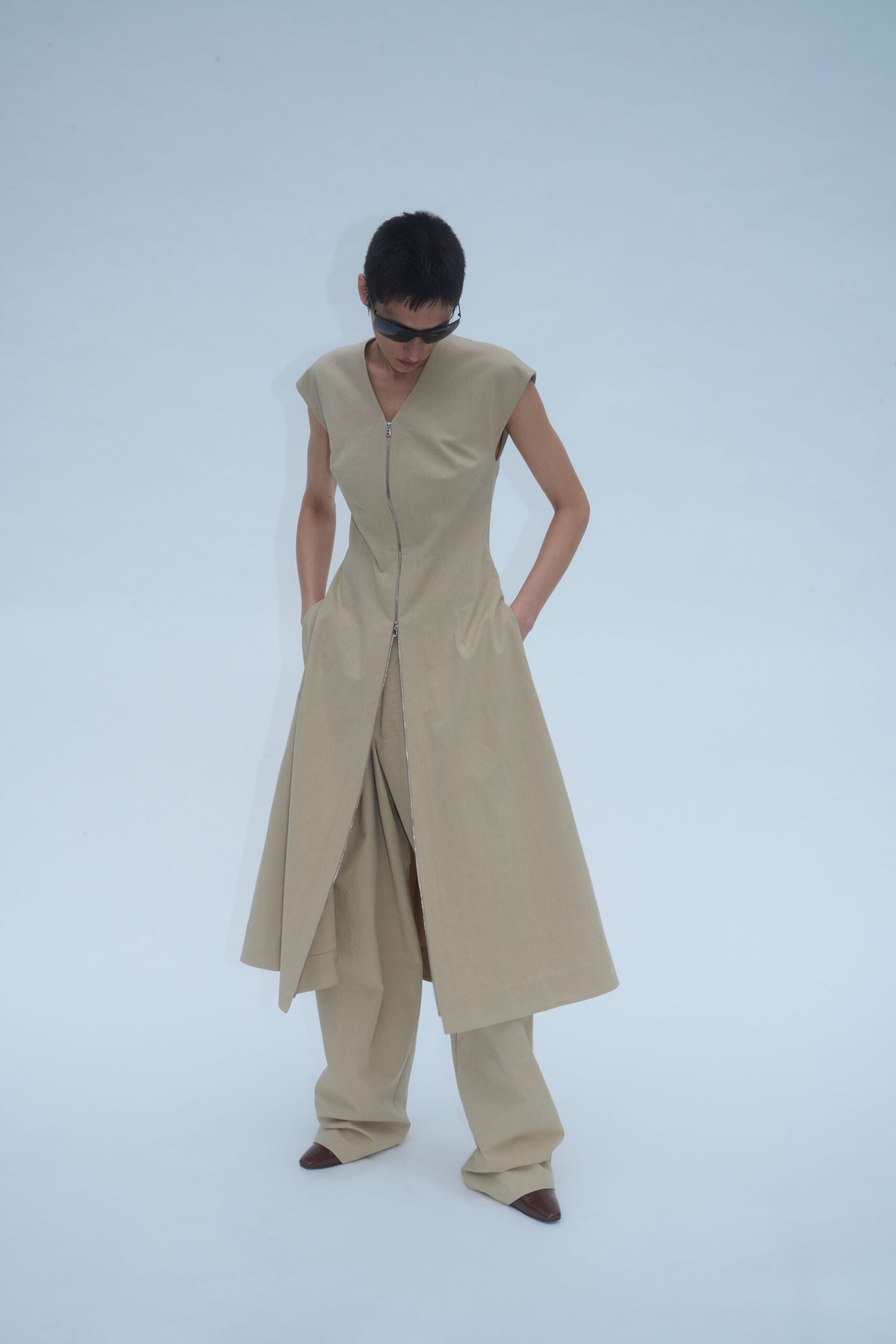 beige sleeveless dress with wide-leg pants
