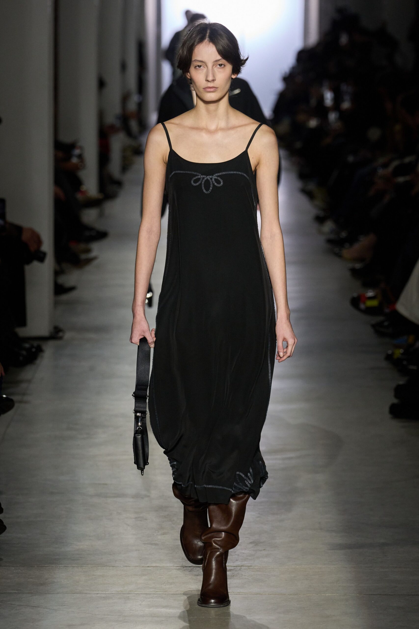black silk sleeveless dress with brown boots
