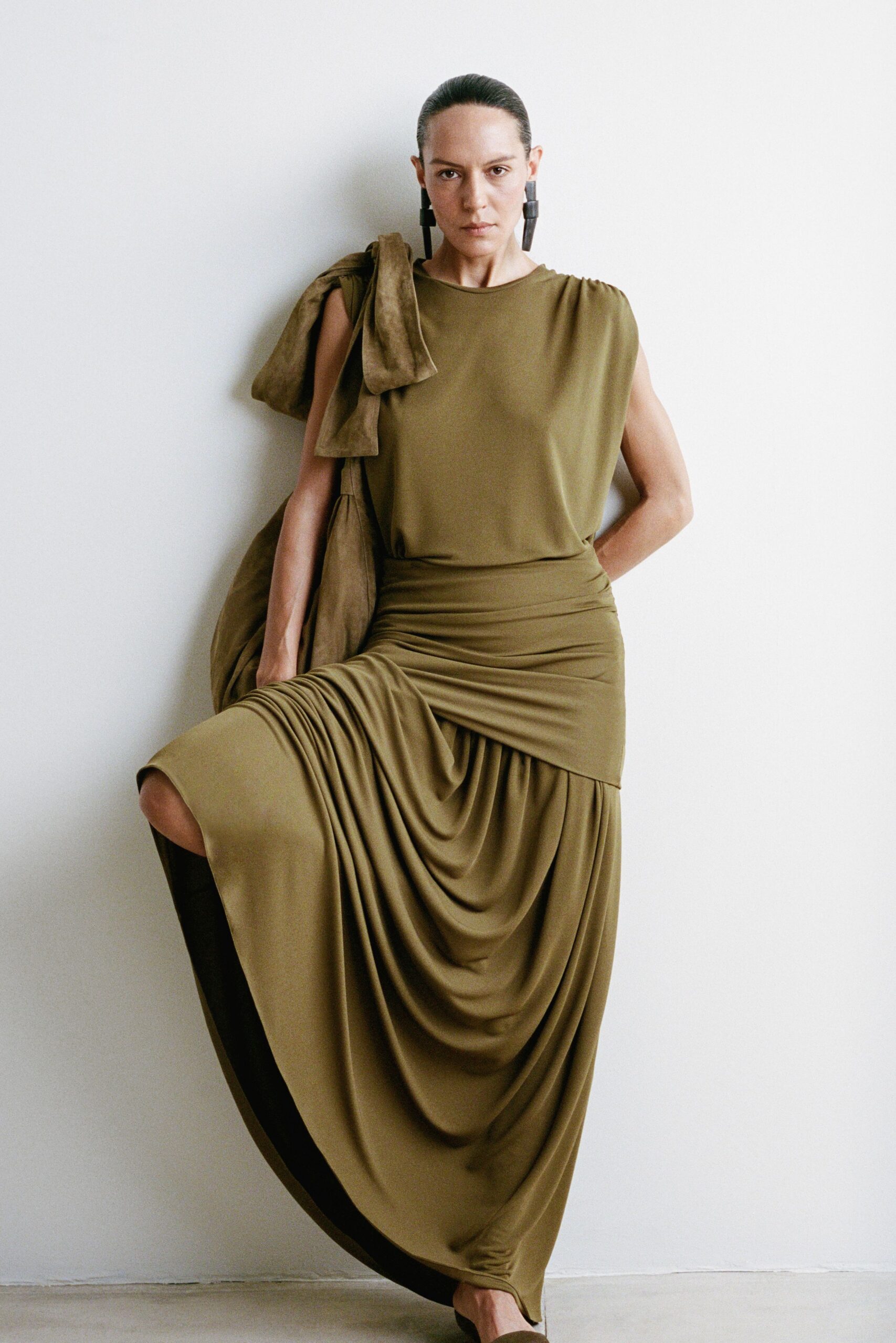 green silk sleeveless high-neck fitted draped flowing dress