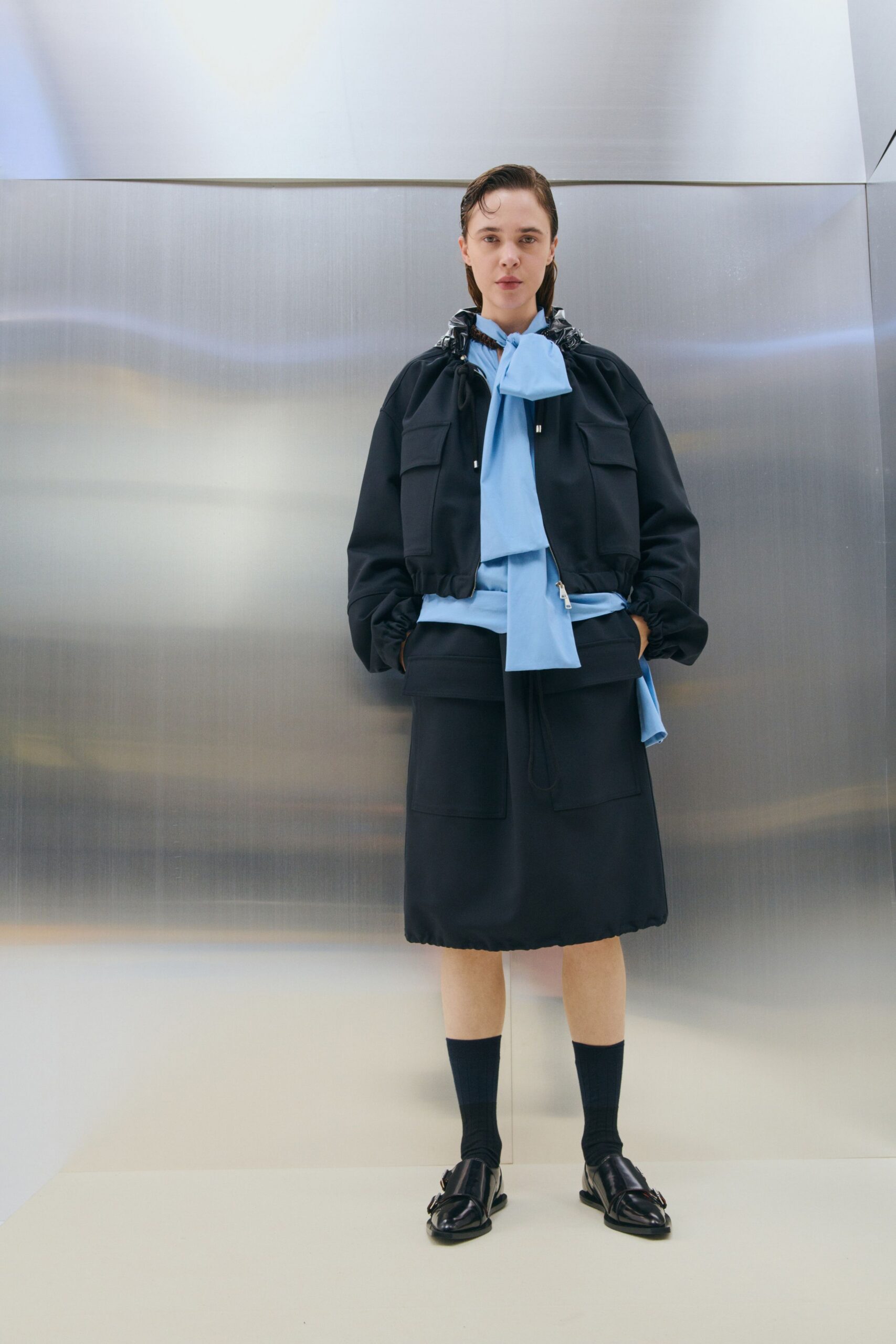 black jacket blue shirt black skirt
