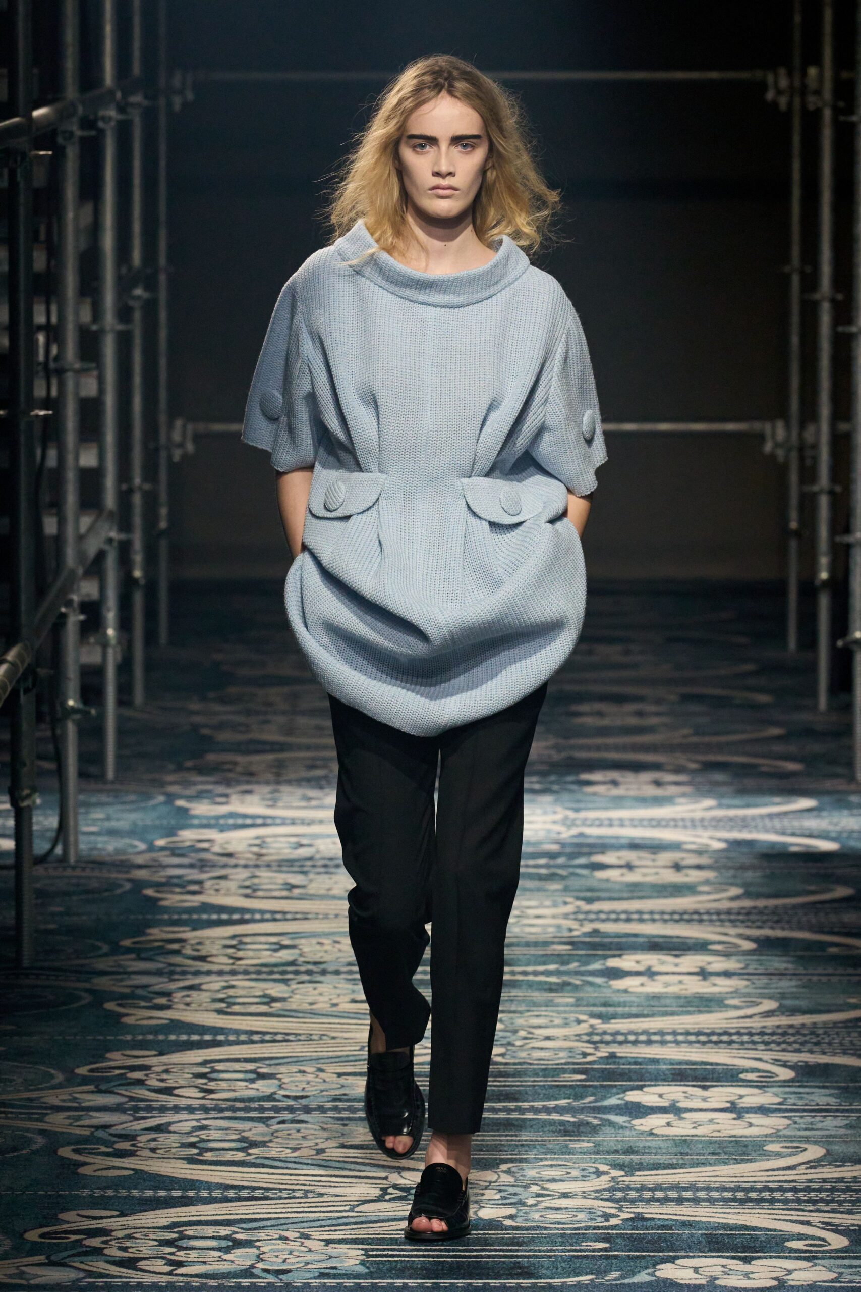blue relaxed top with black pants