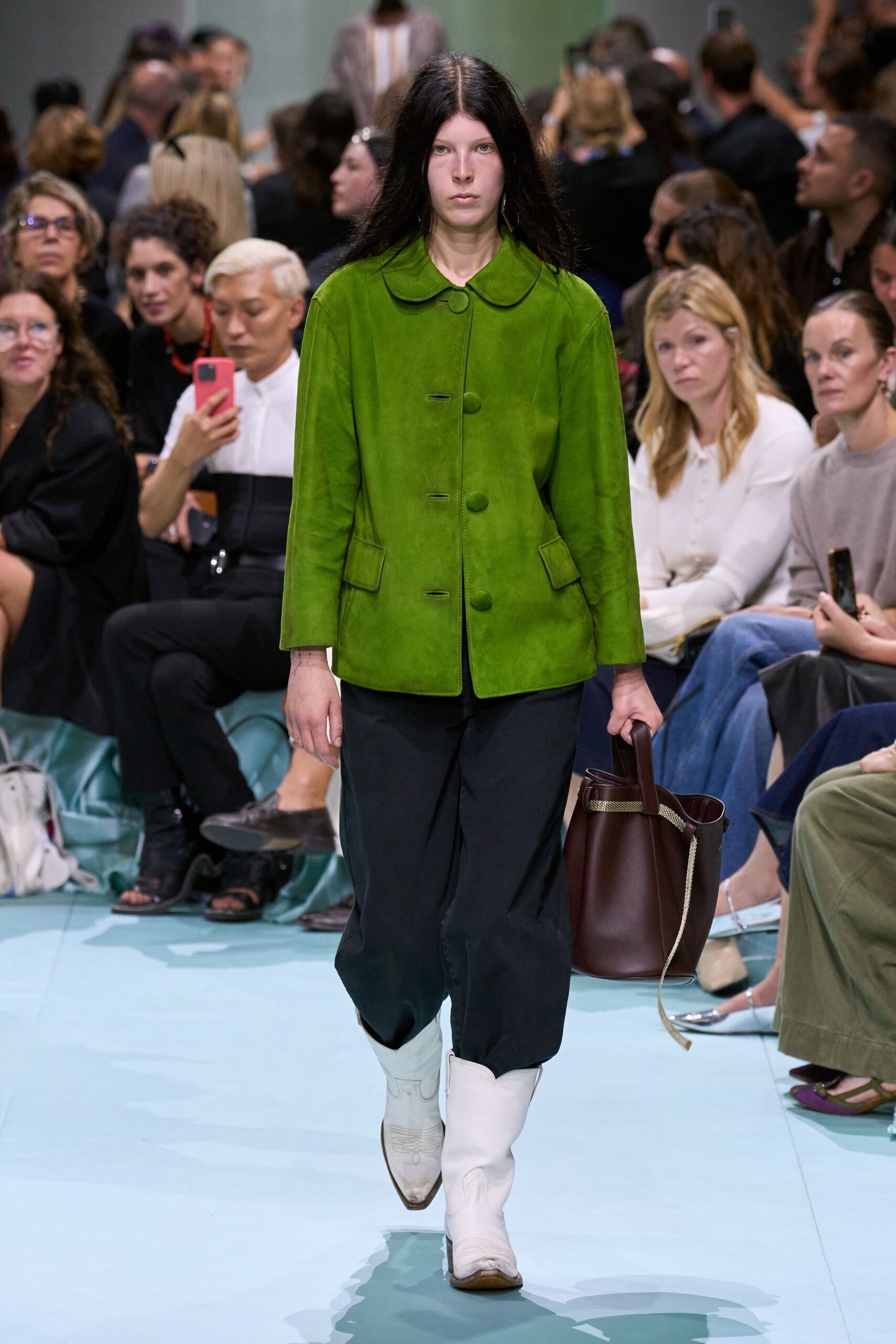 green suede jacket with wide-leg pants