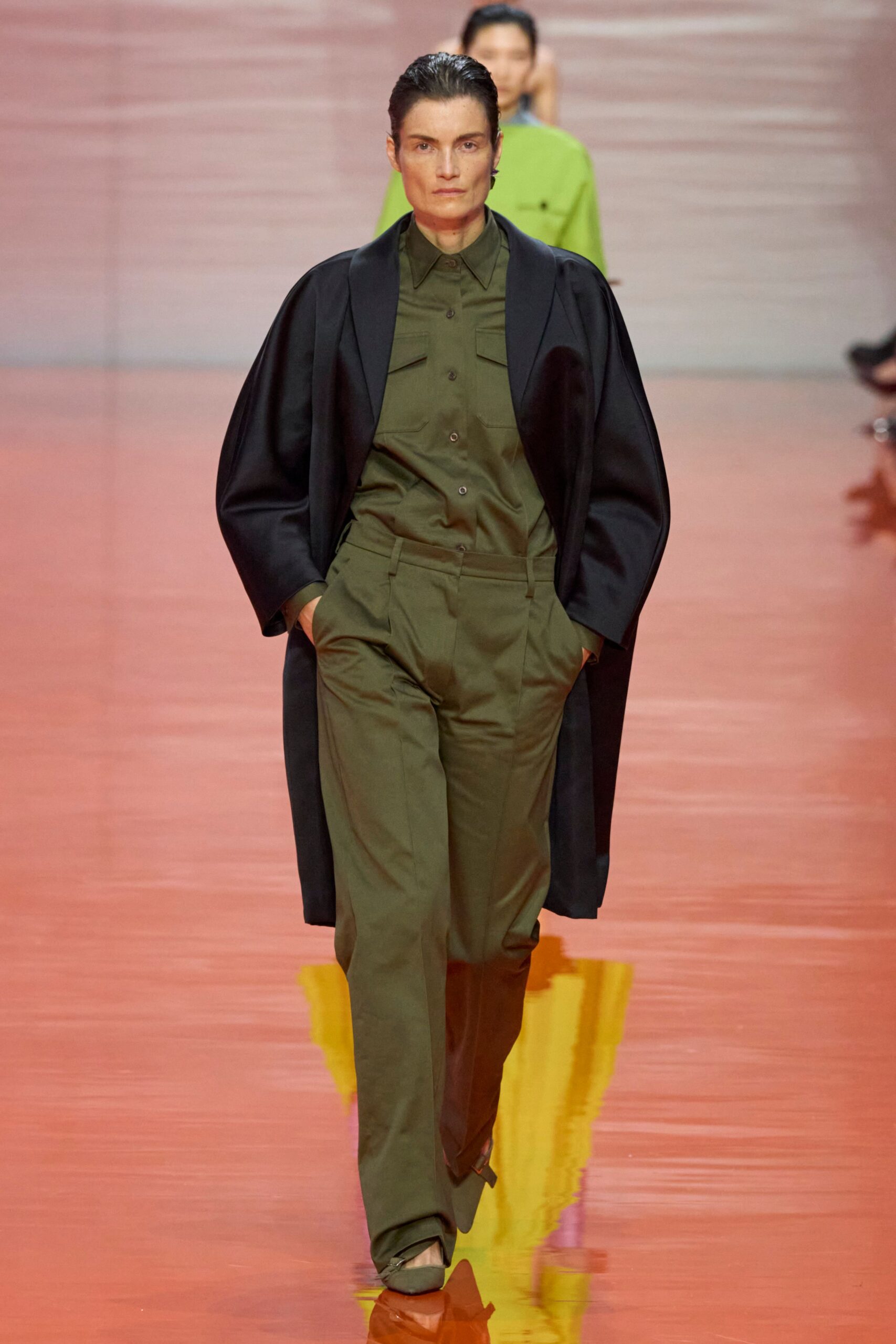 black coat green shirt tailored pants