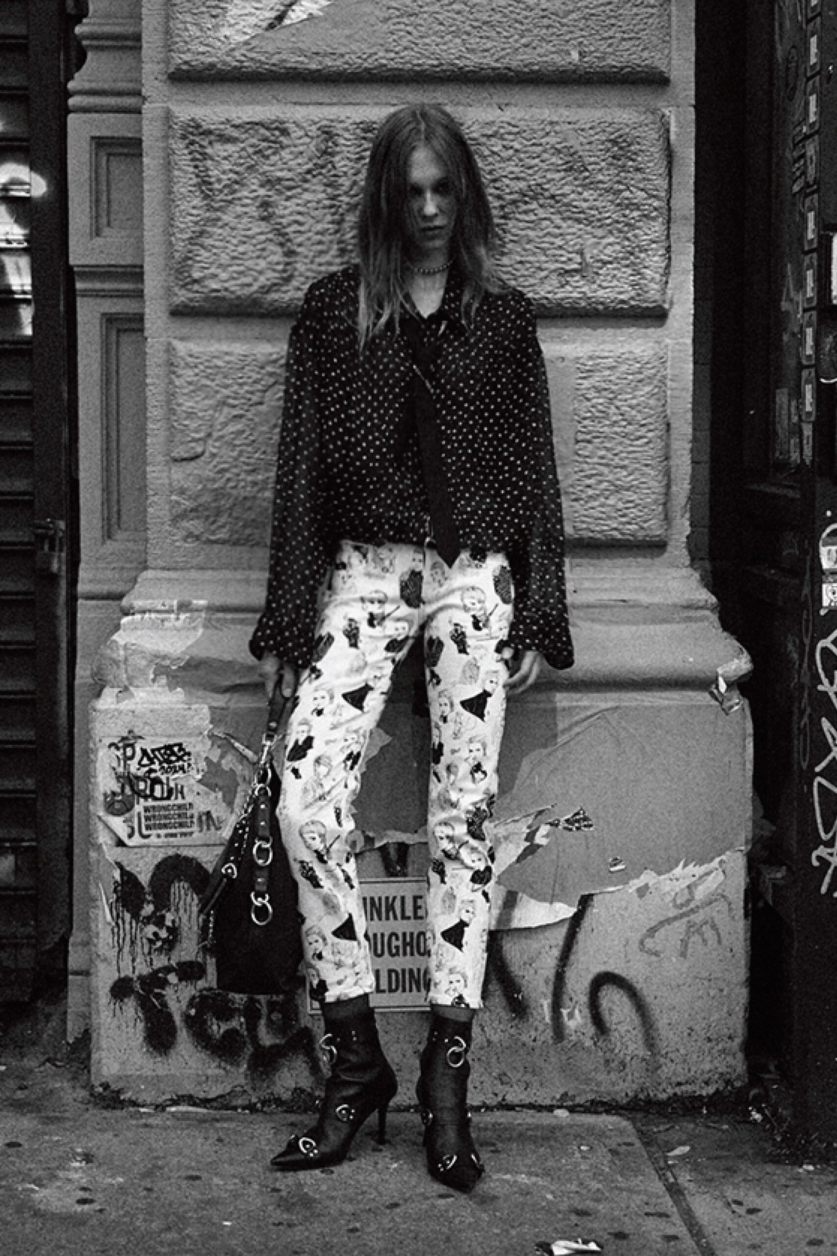 black polka-dot shirt with printed pants