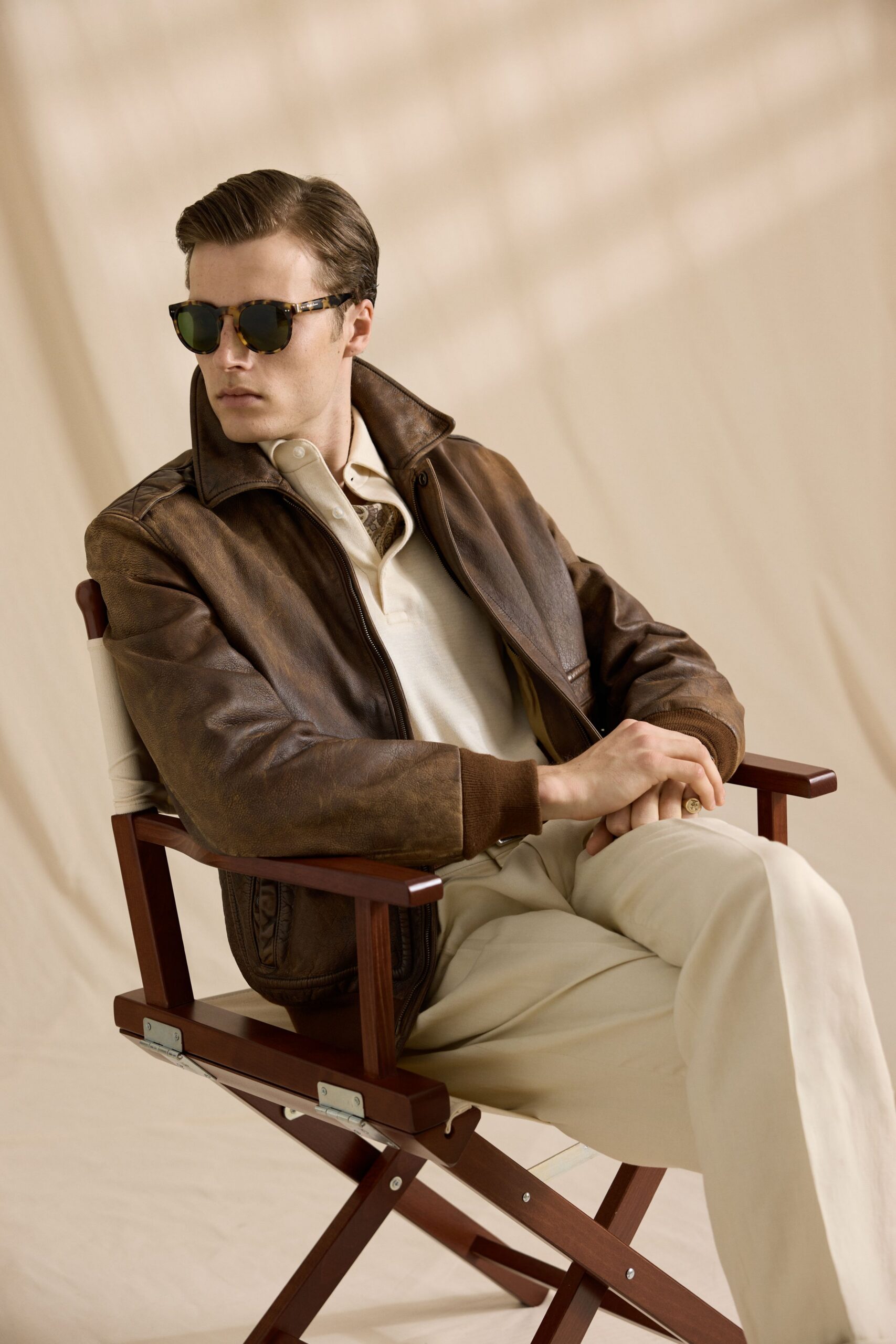 brown leather jacket with sunglasses