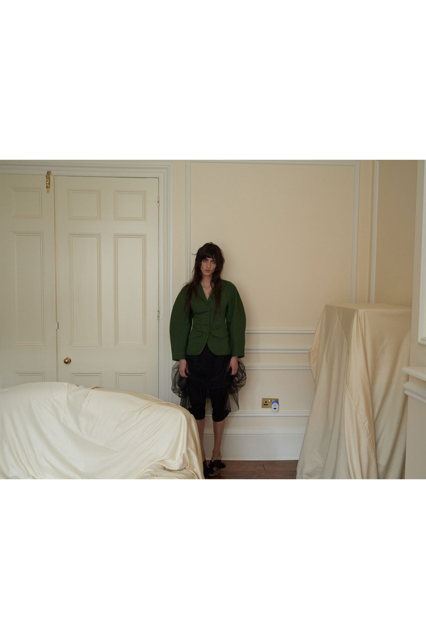 green relaxed jacket black shorts